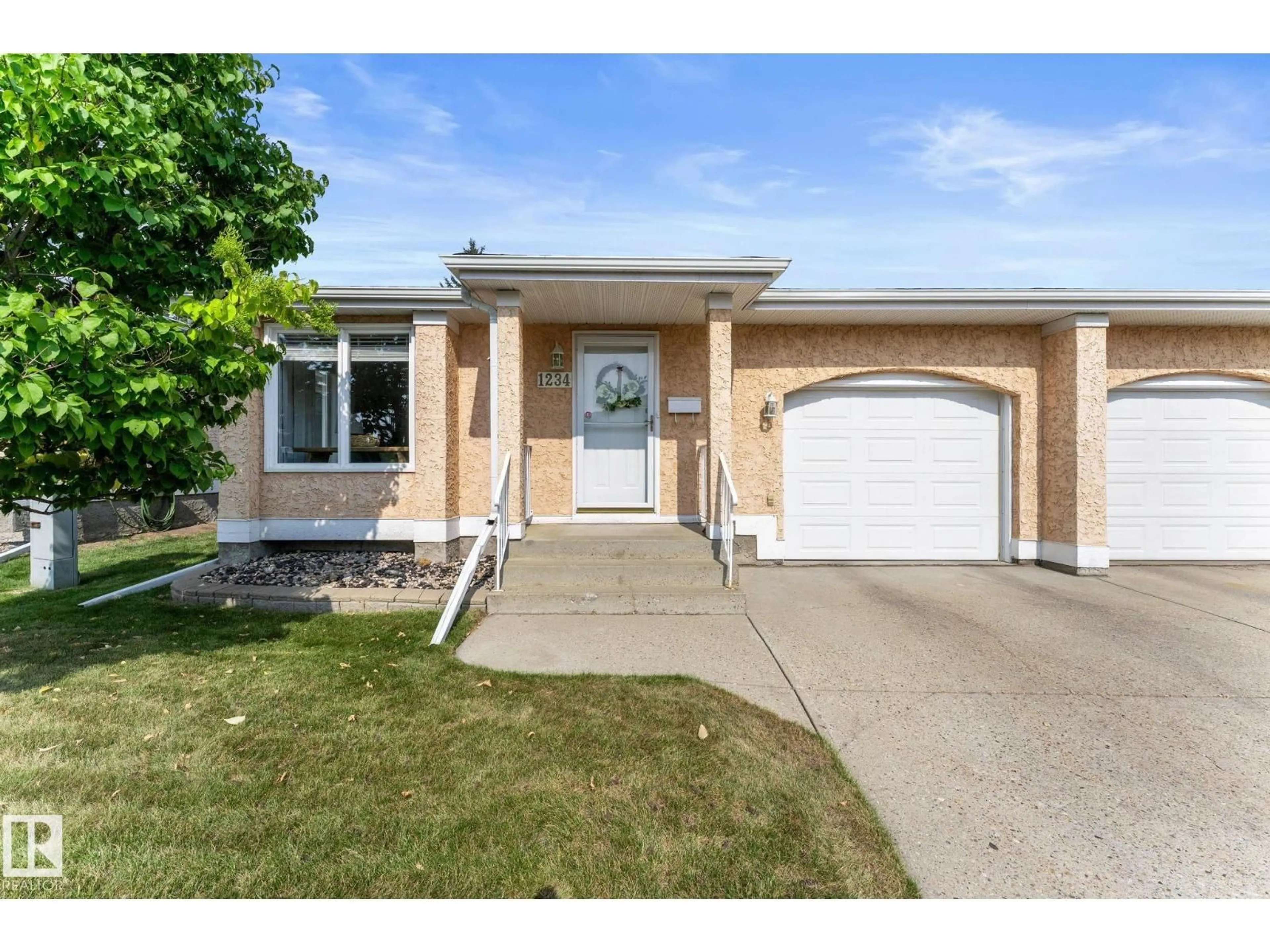 Home with vinyl exterior material, street for 1234 105 ST, Edmonton Alberta T6J6J9