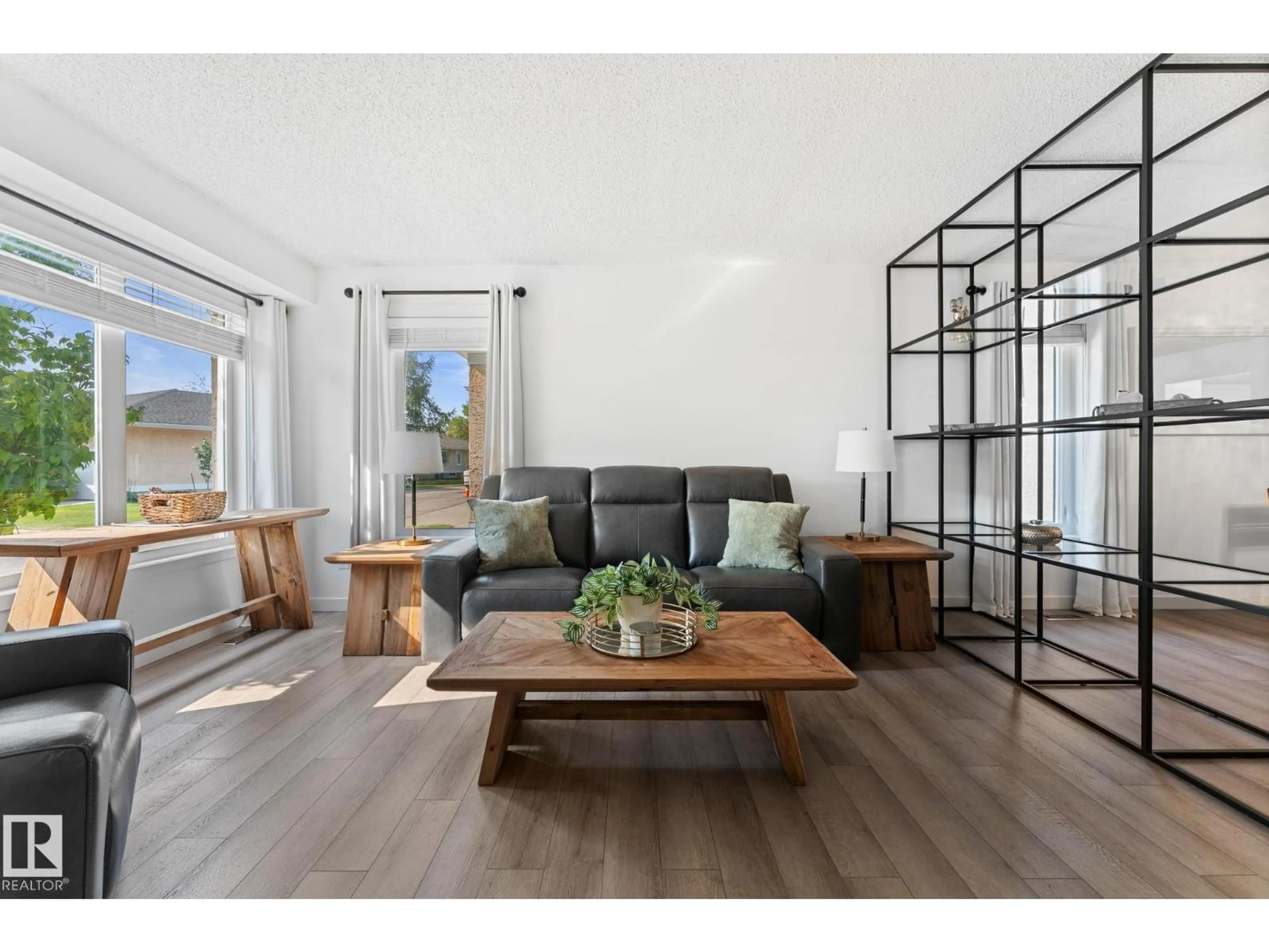 Living room with furniture, wood/laminate floor for 1234 105 ST, Edmonton Alberta T6J6J9