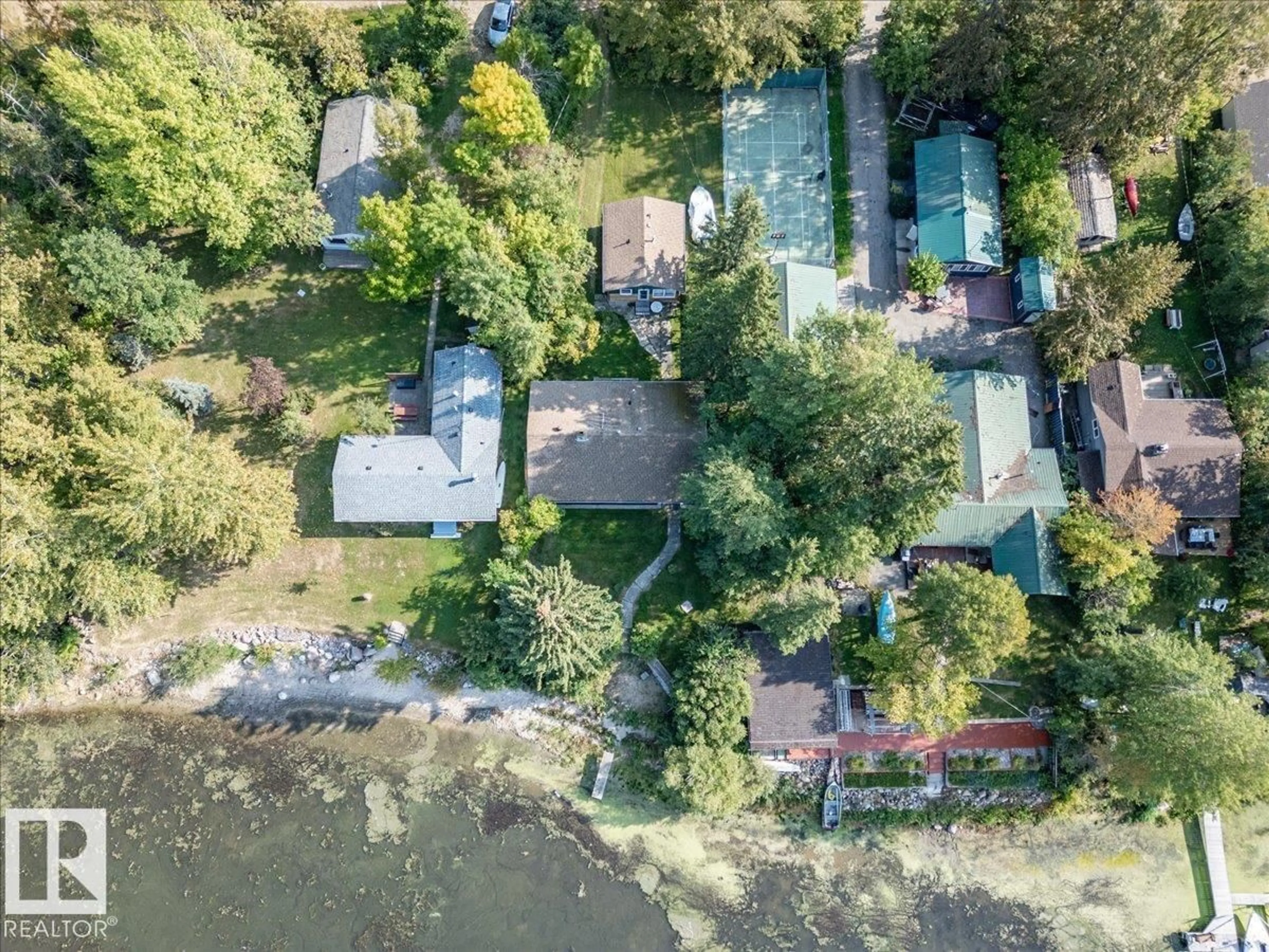 A pic from outside/outdoor area/front of a property/back of a property/a pic from drone, water/lake/river/ocean view for 60 BEACH AVE, Rural Leduc County Alberta T0C2C0