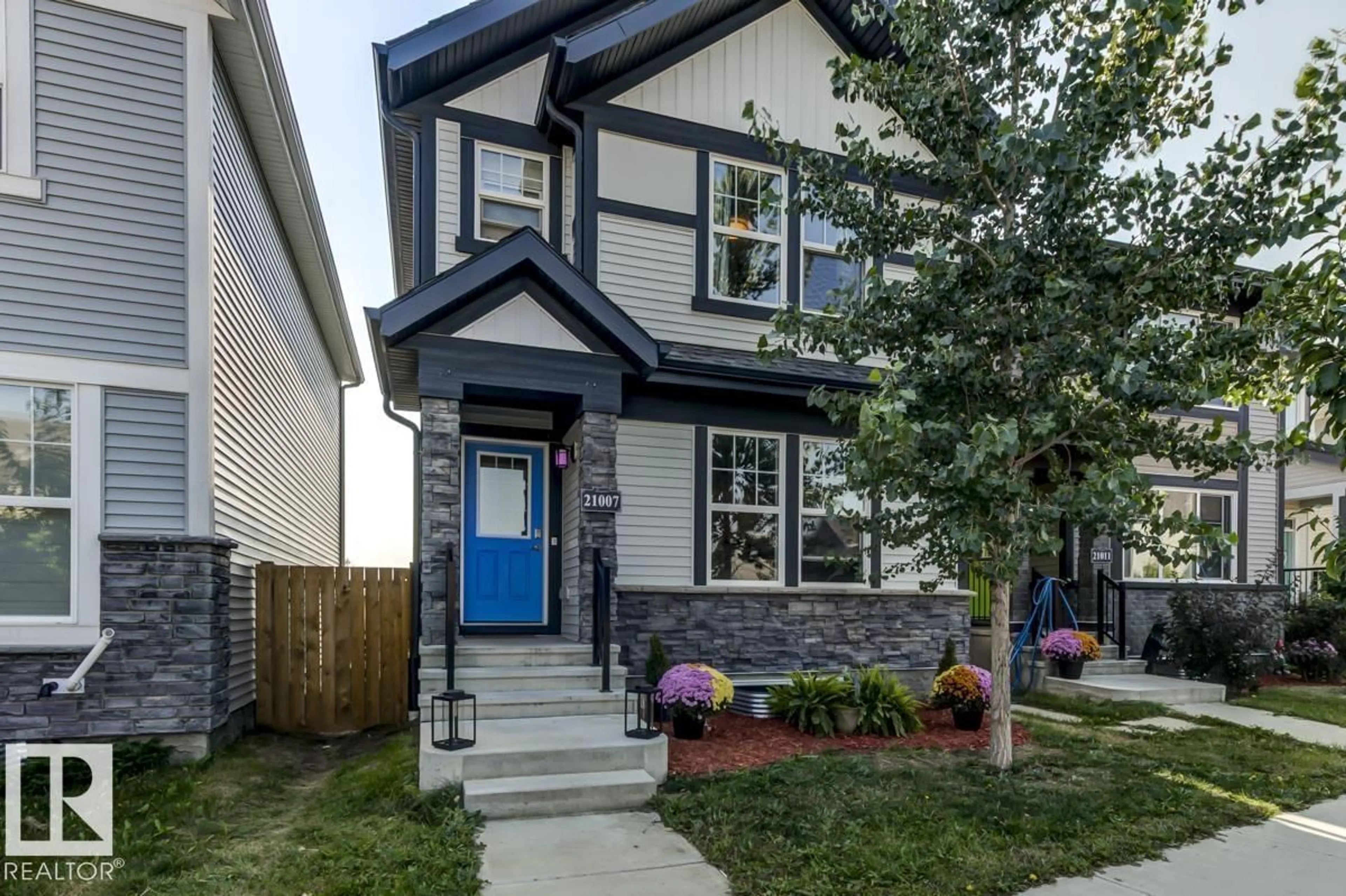 Home with brick exterior material, street for NW - 21007 130 AV, Edmonton Alberta T5S0L4