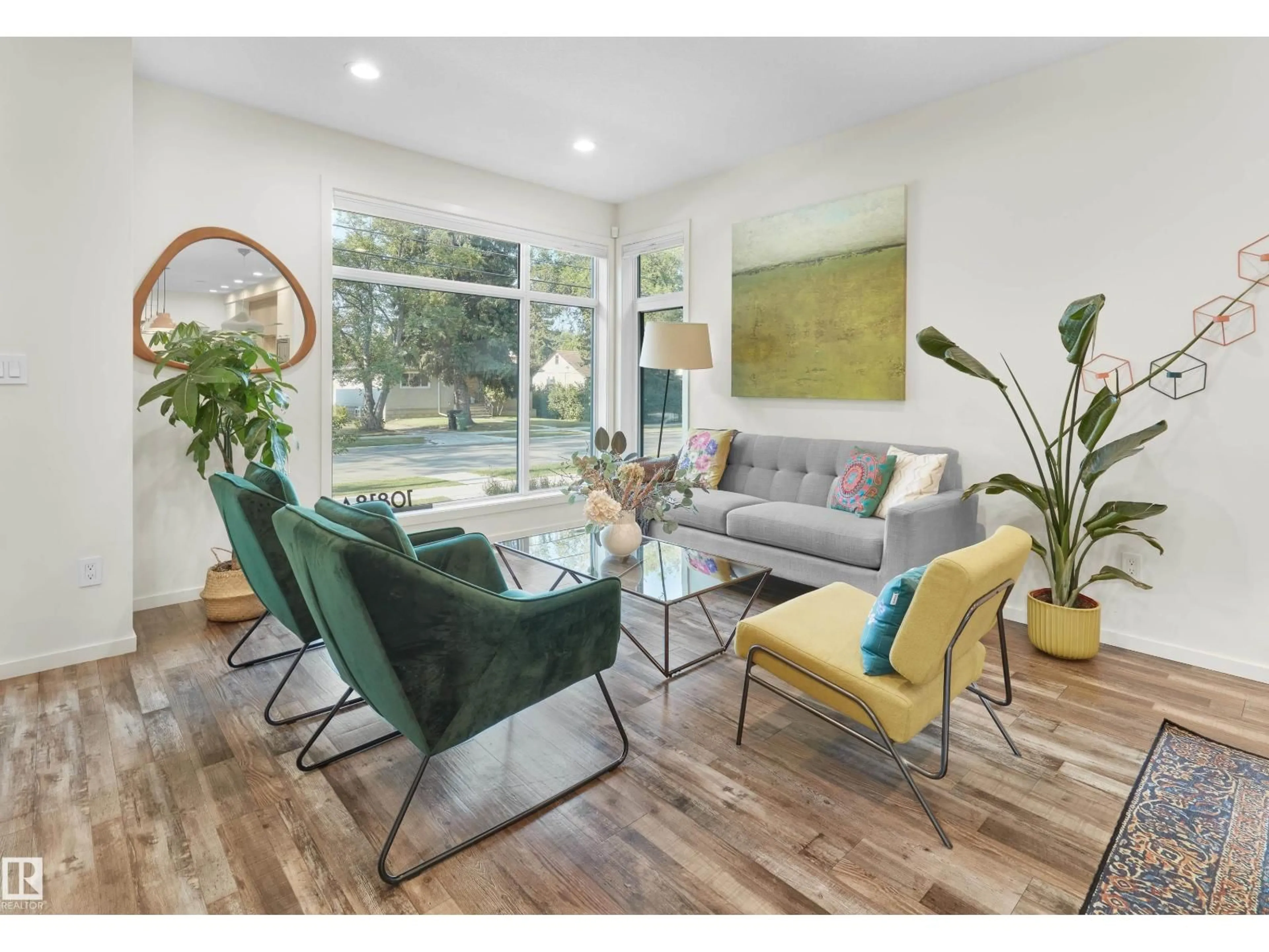 Living room with furniture, wood/laminate floor for NW - 10818A 60 AV, Edmonton Alberta T6X1N6
