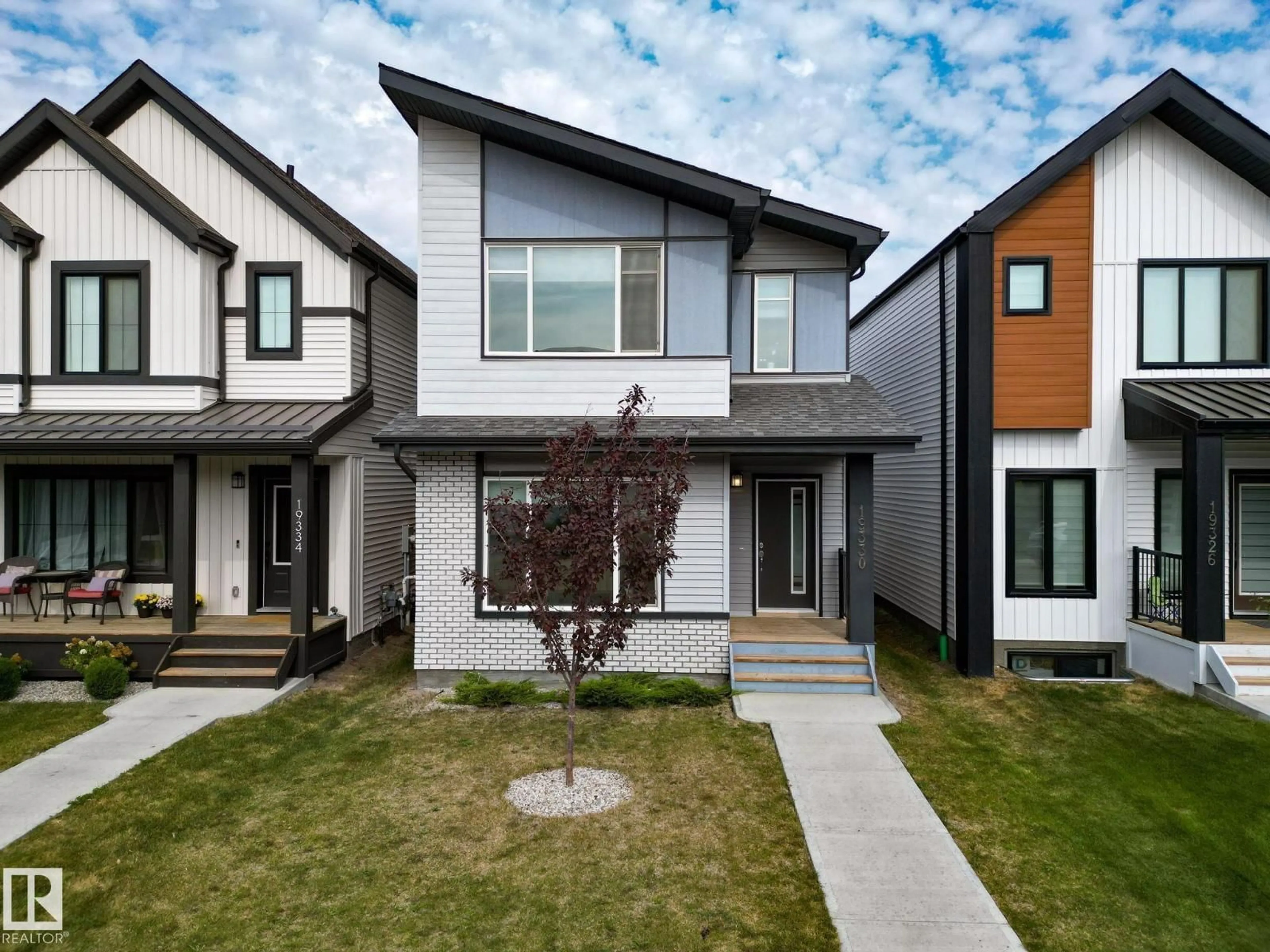 Home with vinyl exterior material, street for 19330 26A AV, Edmonton Alberta T6M1L2