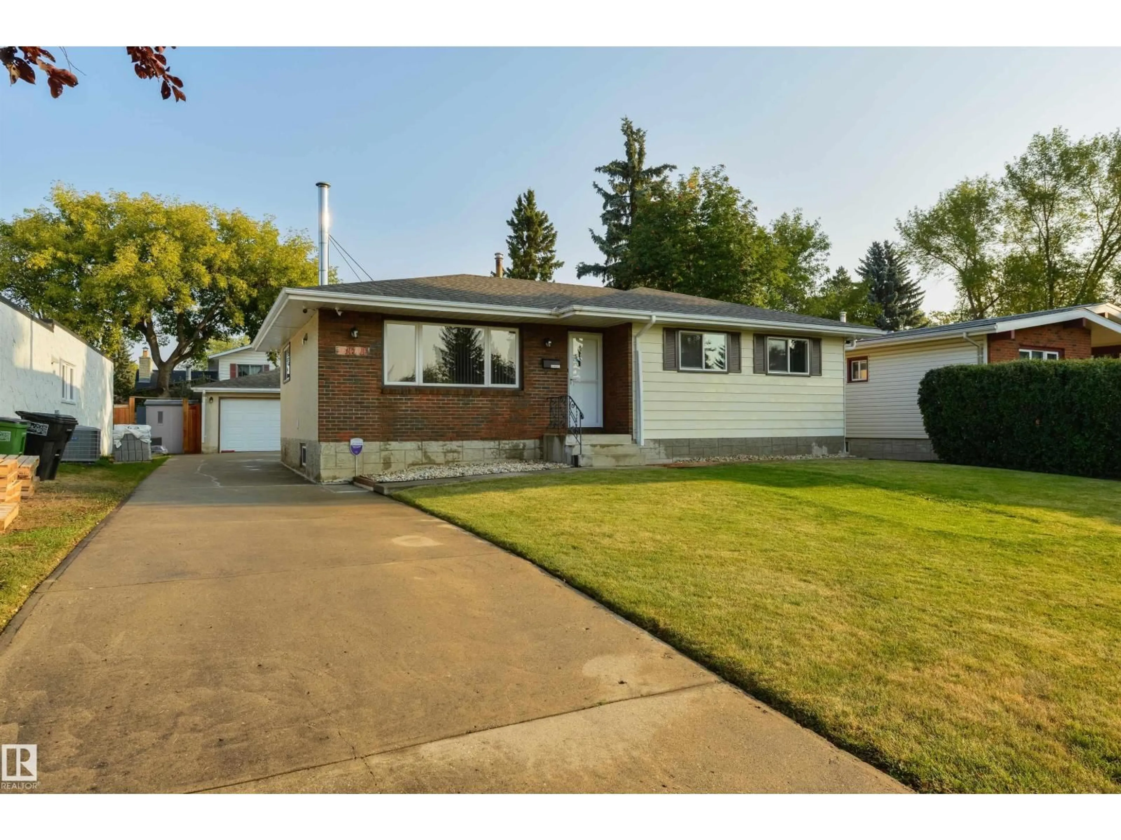 Home with vinyl exterior material, street for NW - 10524 35 AV, Edmonton Alberta T6H4Z5