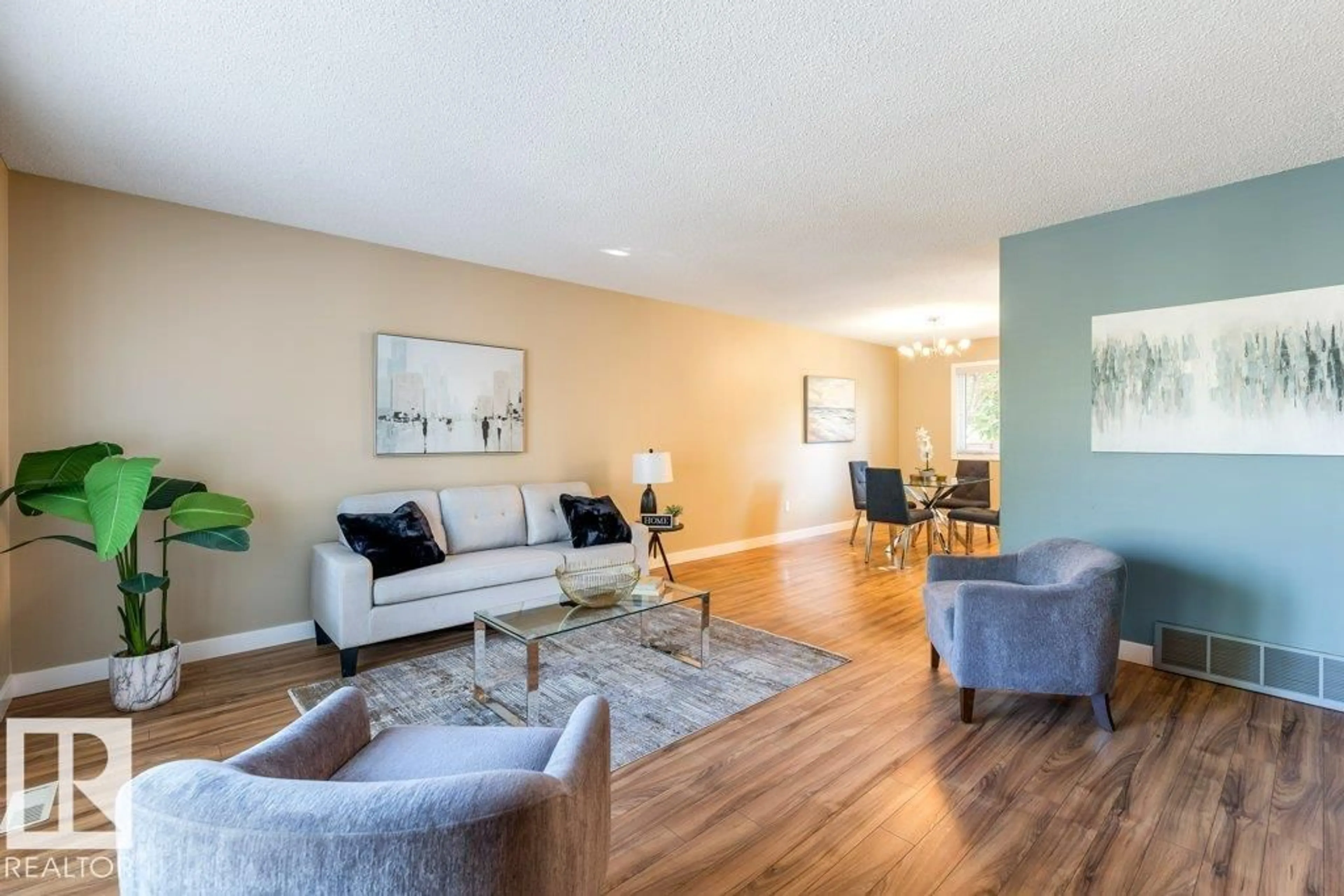 Living room with furniture, wood/laminate floor for 9 DUNCAN, St. Albert Alberta T8N4Z1