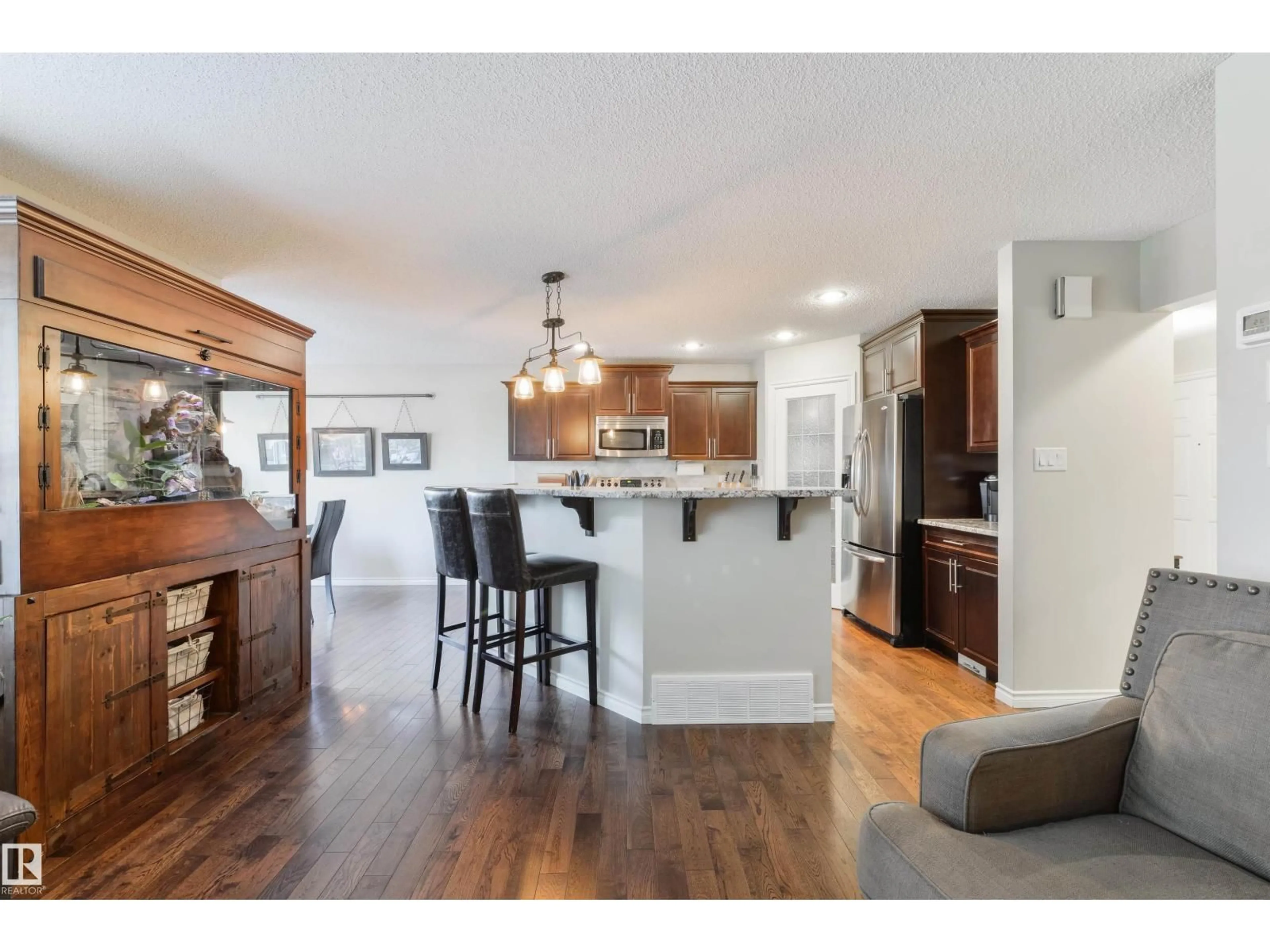 Open concept kitchen, wood/laminate floor for 8504 16A AV, Edmonton Alberta T6X0H9