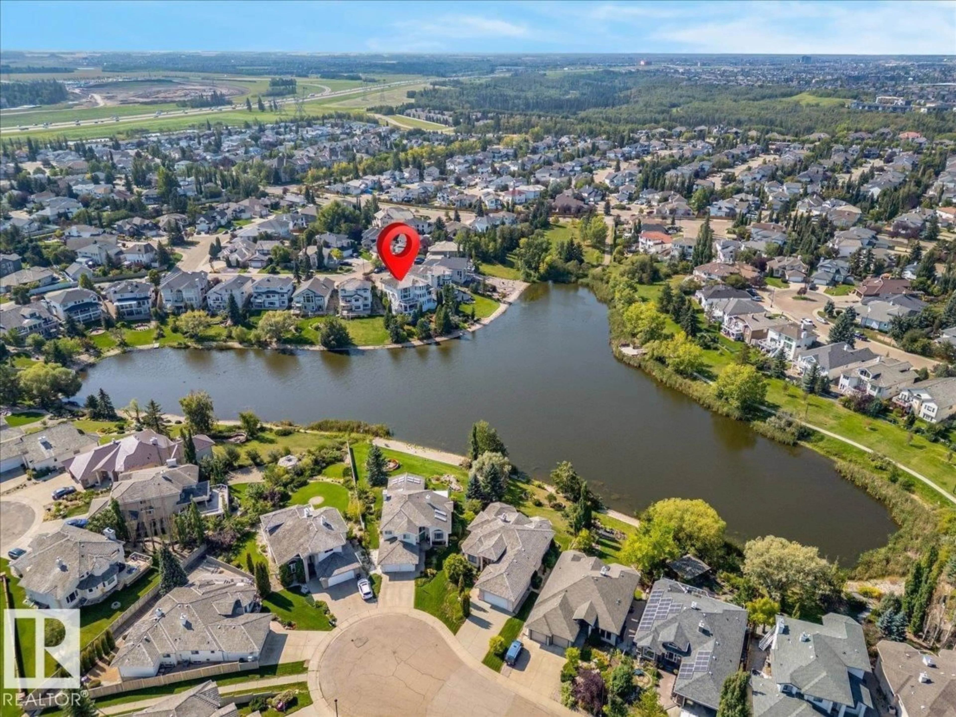 A pic from outside/outdoor area/front of a property/back of a property/a pic from drone, water/lake/river/ocean view for 138 TWIN BROOKS COVE CV, Edmonton Alberta T6J6W6