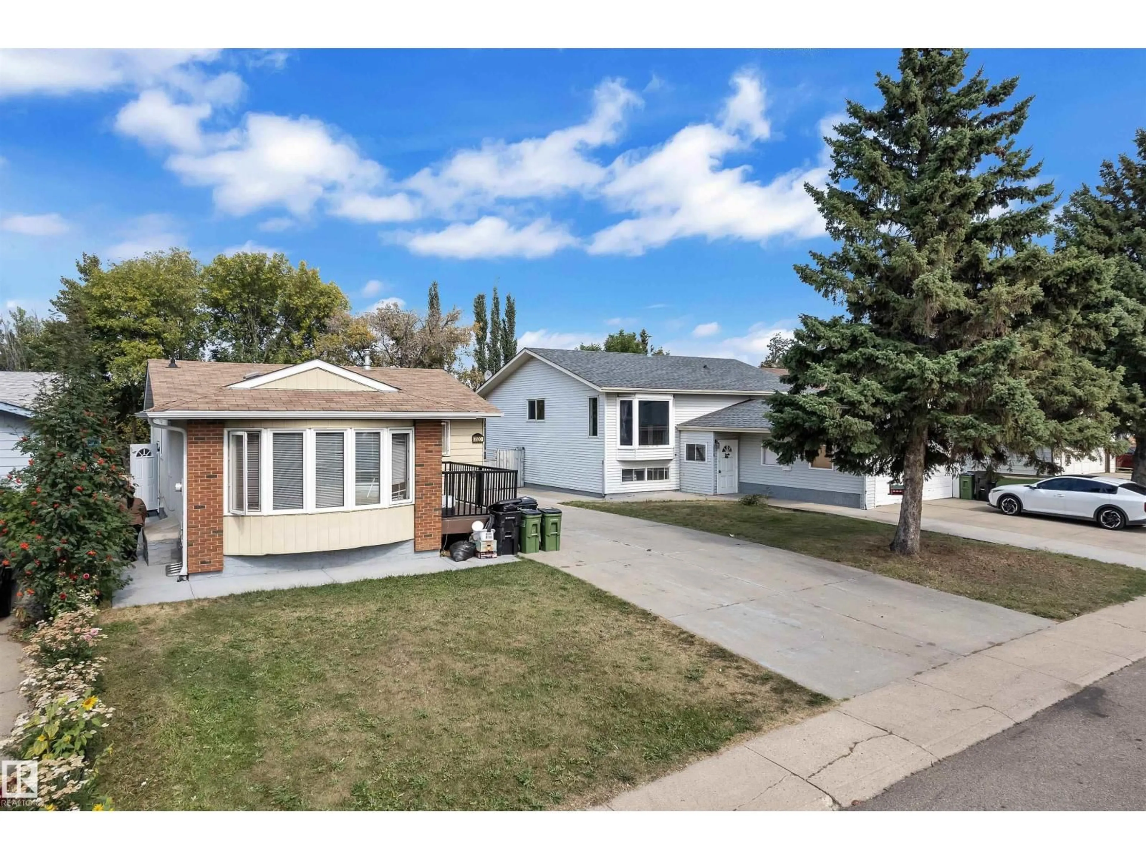 Home with vinyl exterior material, street for 3520 19 AV, Edmonton Alberta T6L2Z9