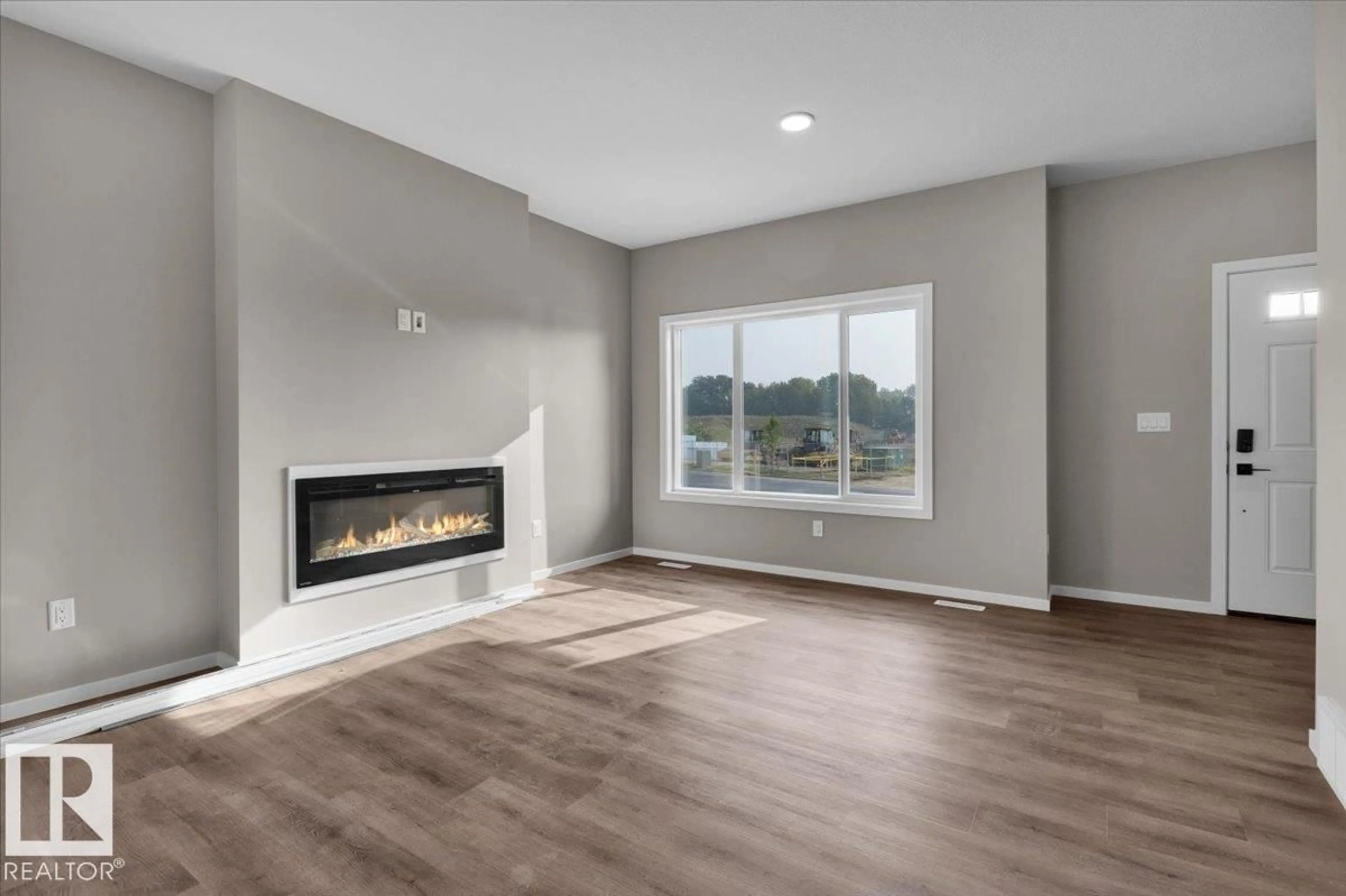 Living room with furniture, unknown for 55 SERENO LN, Fort Saskatchewan Alberta T8L0Z9