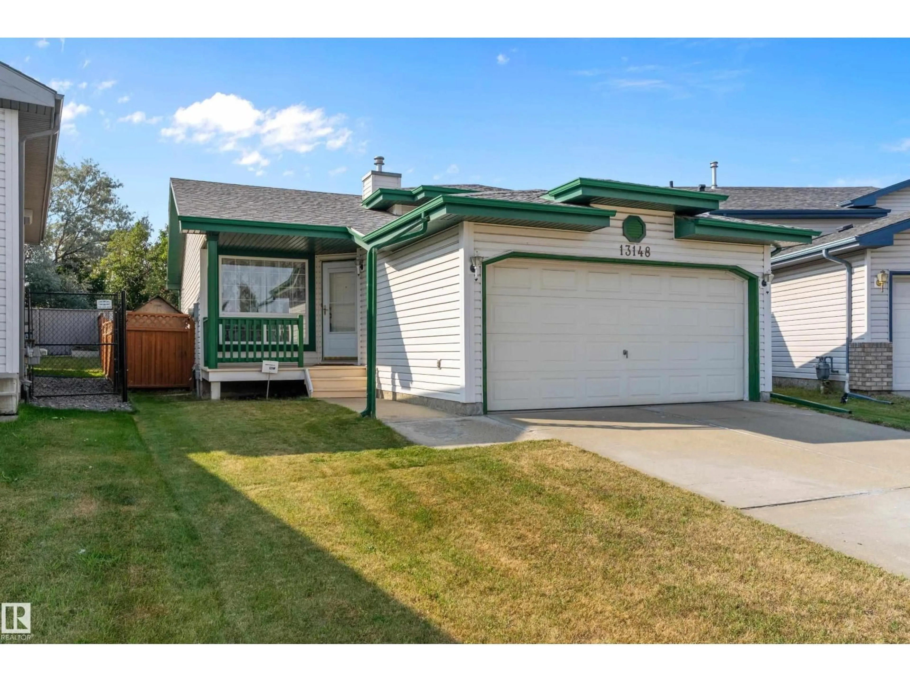 Home with vinyl exterior material, street for NW - 13148 36 ST, Edmonton Alberta T5A5C7