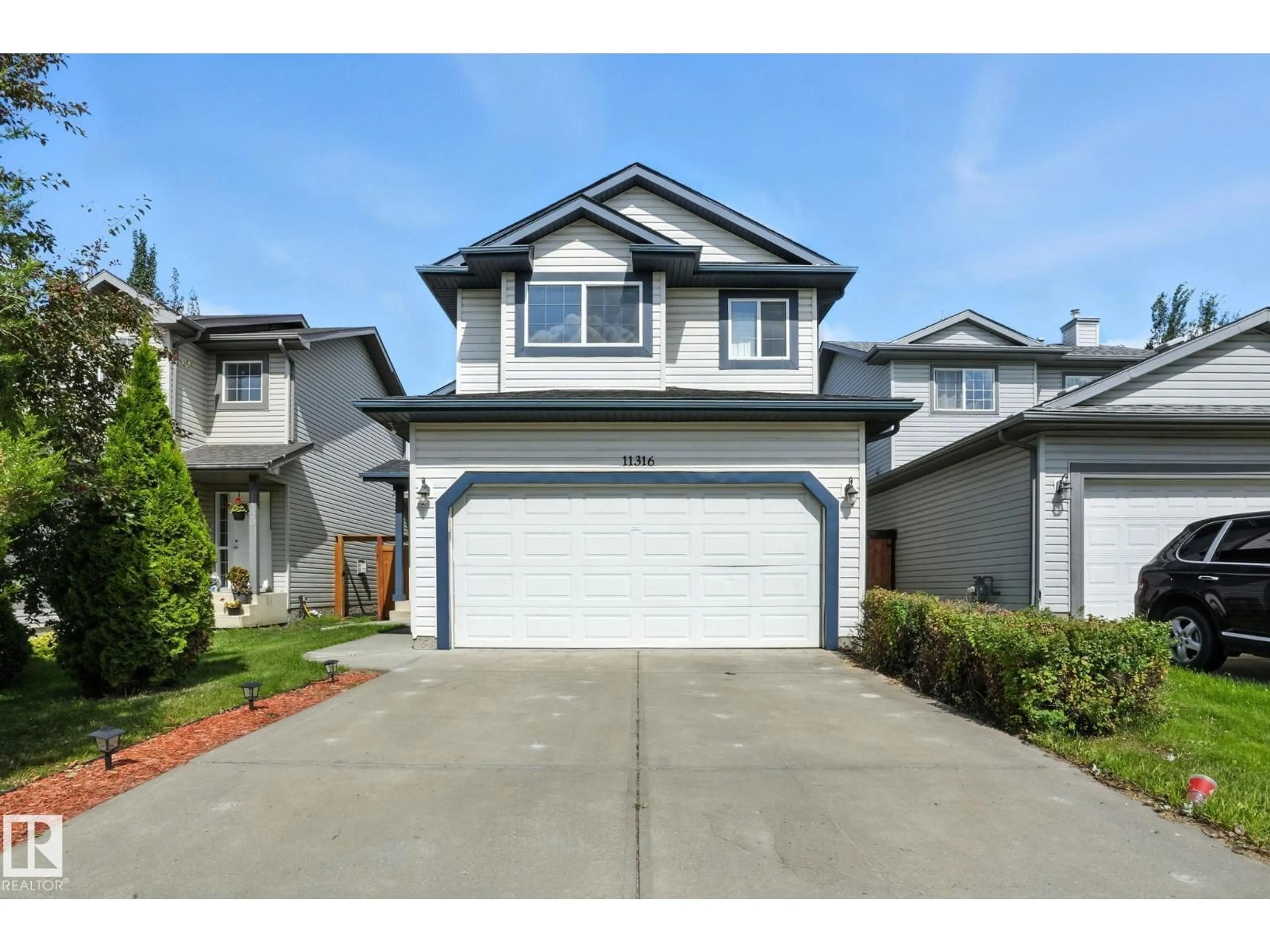 Home with vinyl exterior material, street for NW - 11316 167B AV, Edmonton Alberta T5X6G8