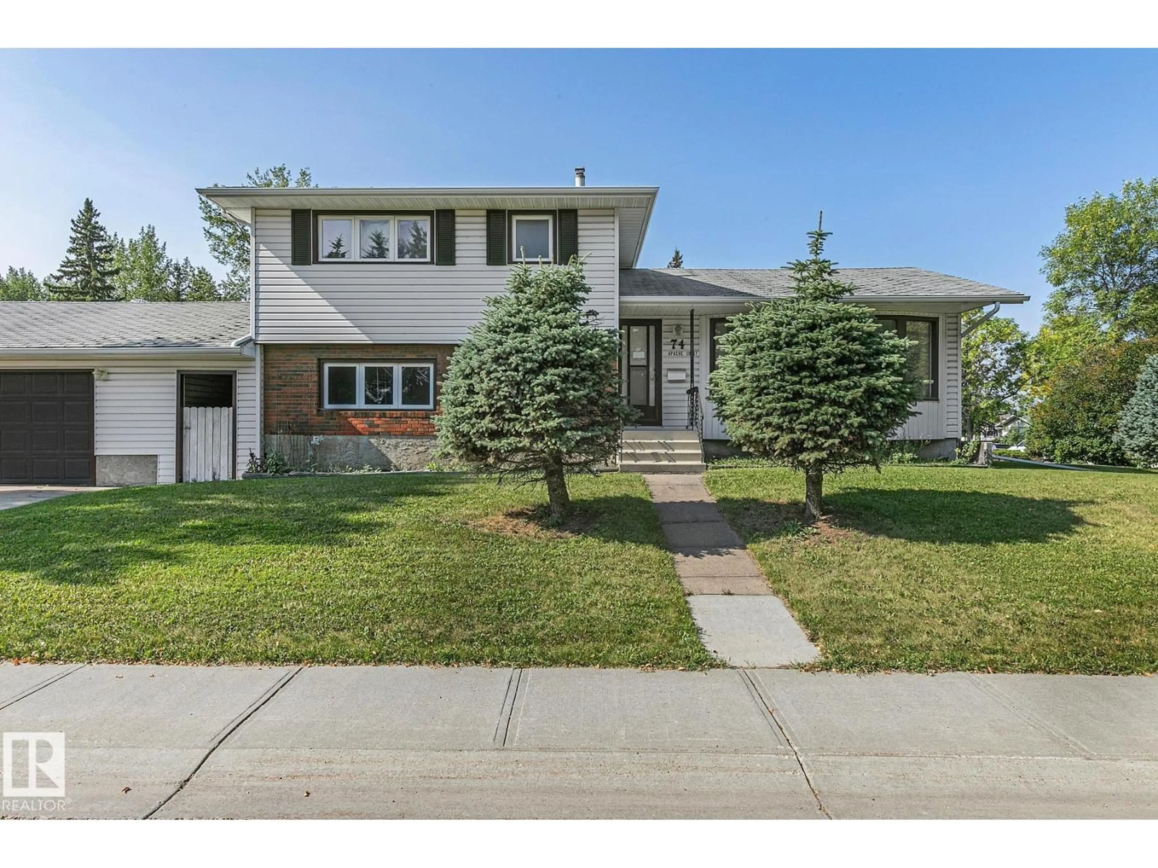 Home with vinyl exterior material, street for 74 APACHE CR, Leduc Alberta T9E4H4