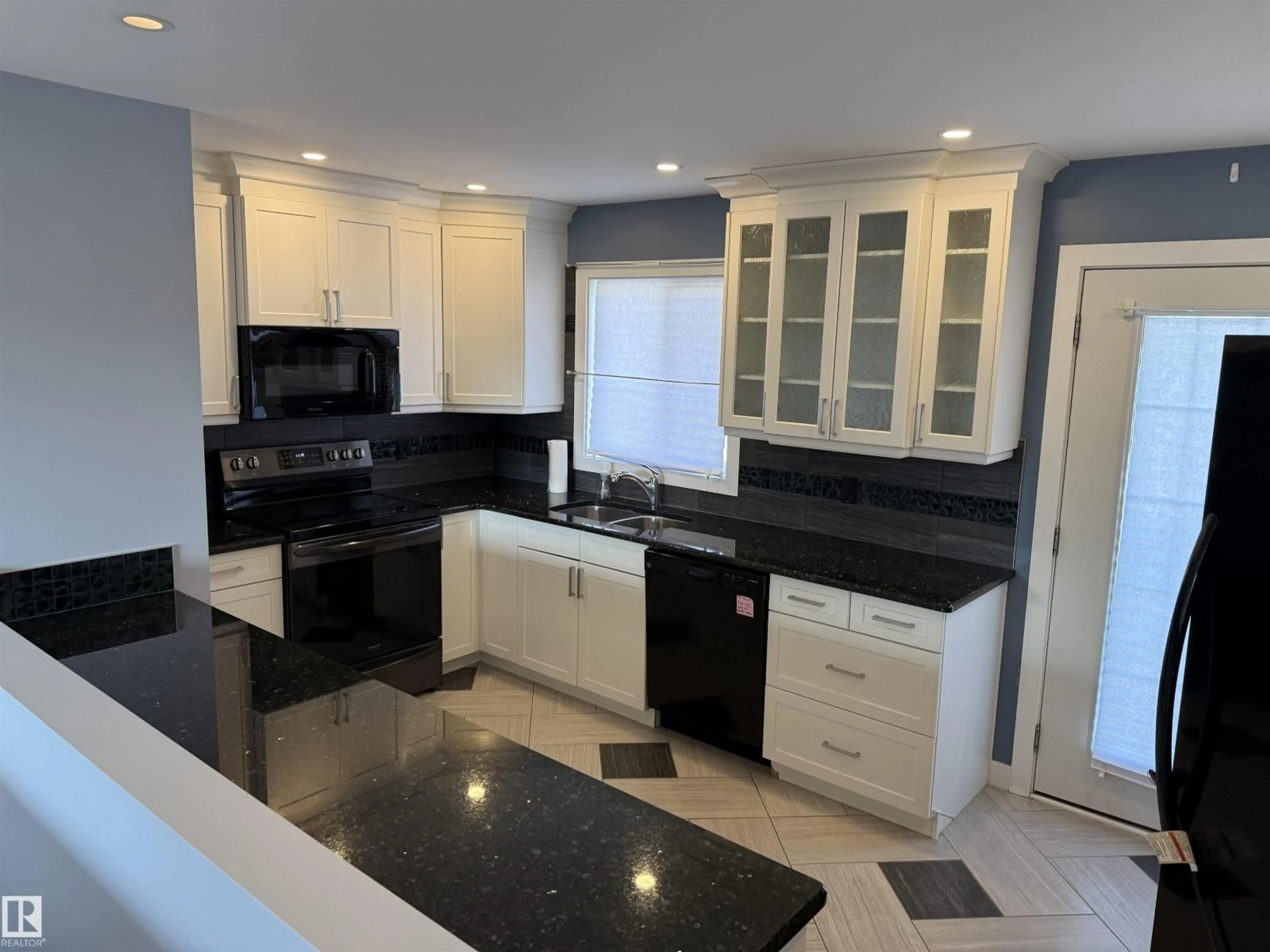 Open concept kitchen, ceramic/tile floor for 13812 132 AV, Edmonton Alberta T5L3R8