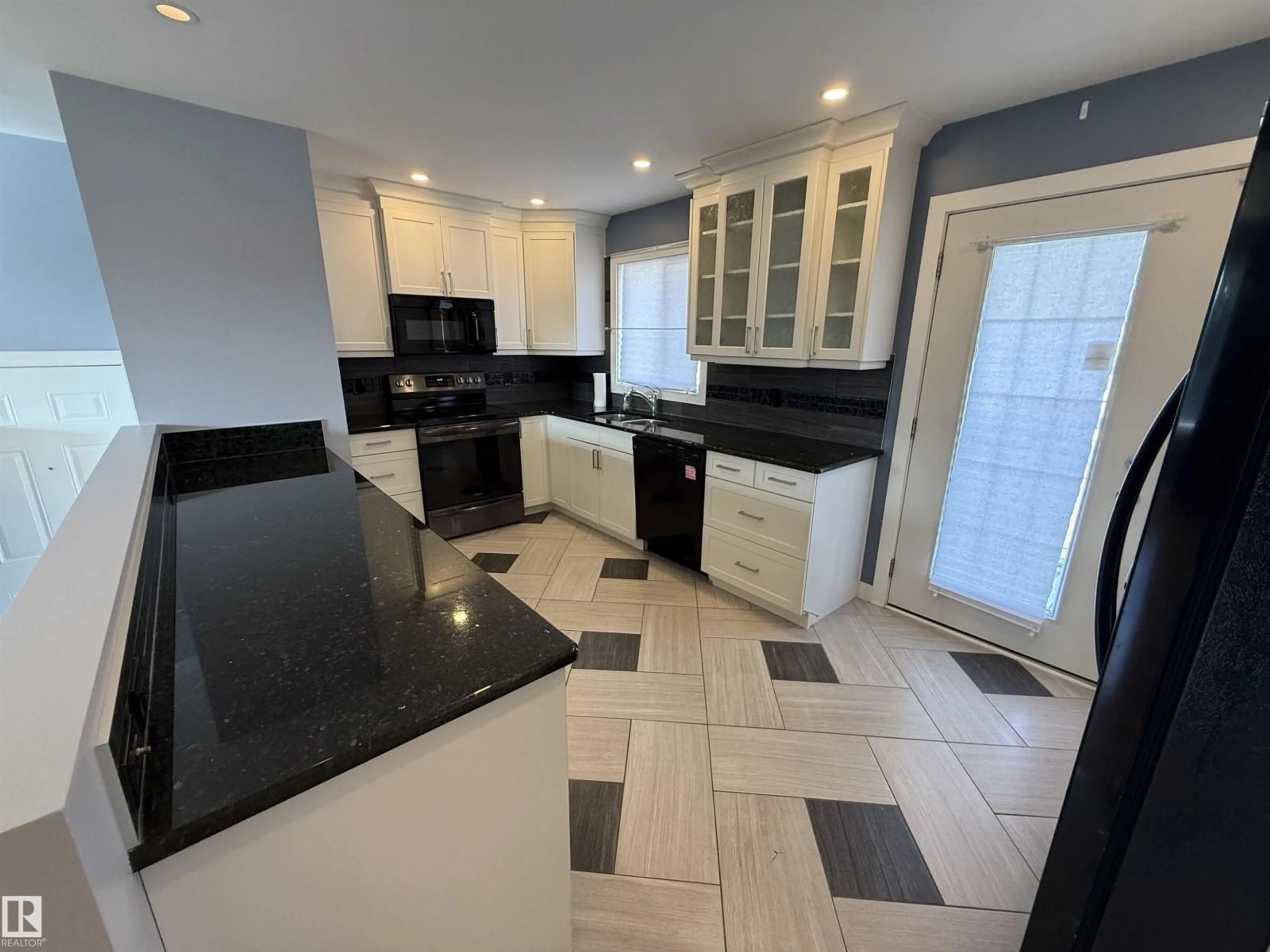 Open concept kitchen, ceramic/tile floor for 13812 132 AV, Edmonton Alberta T5L3R8