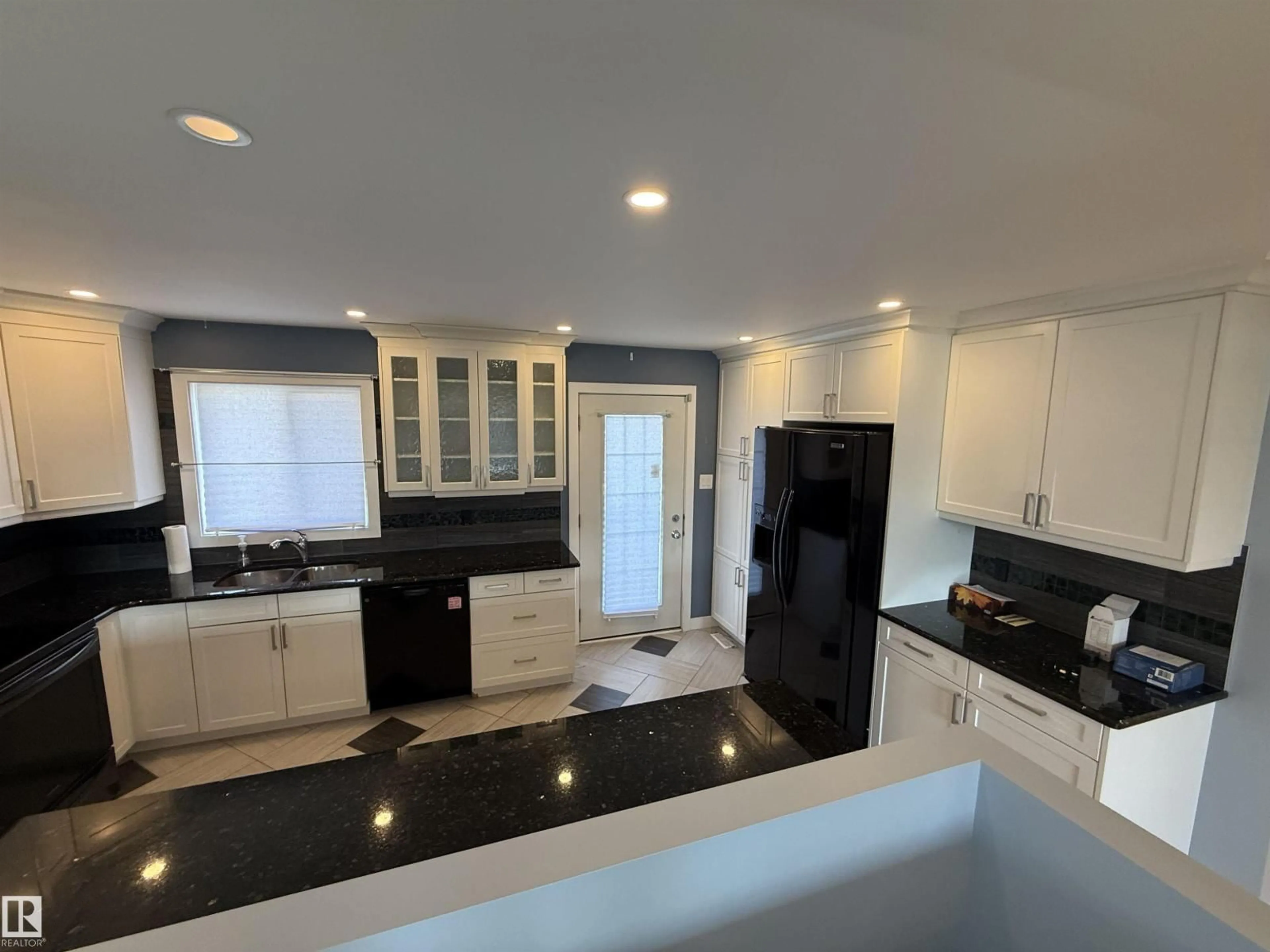 Open concept kitchen, ceramic/tile floor for 13812 132 AV, Edmonton Alberta T5L3R8