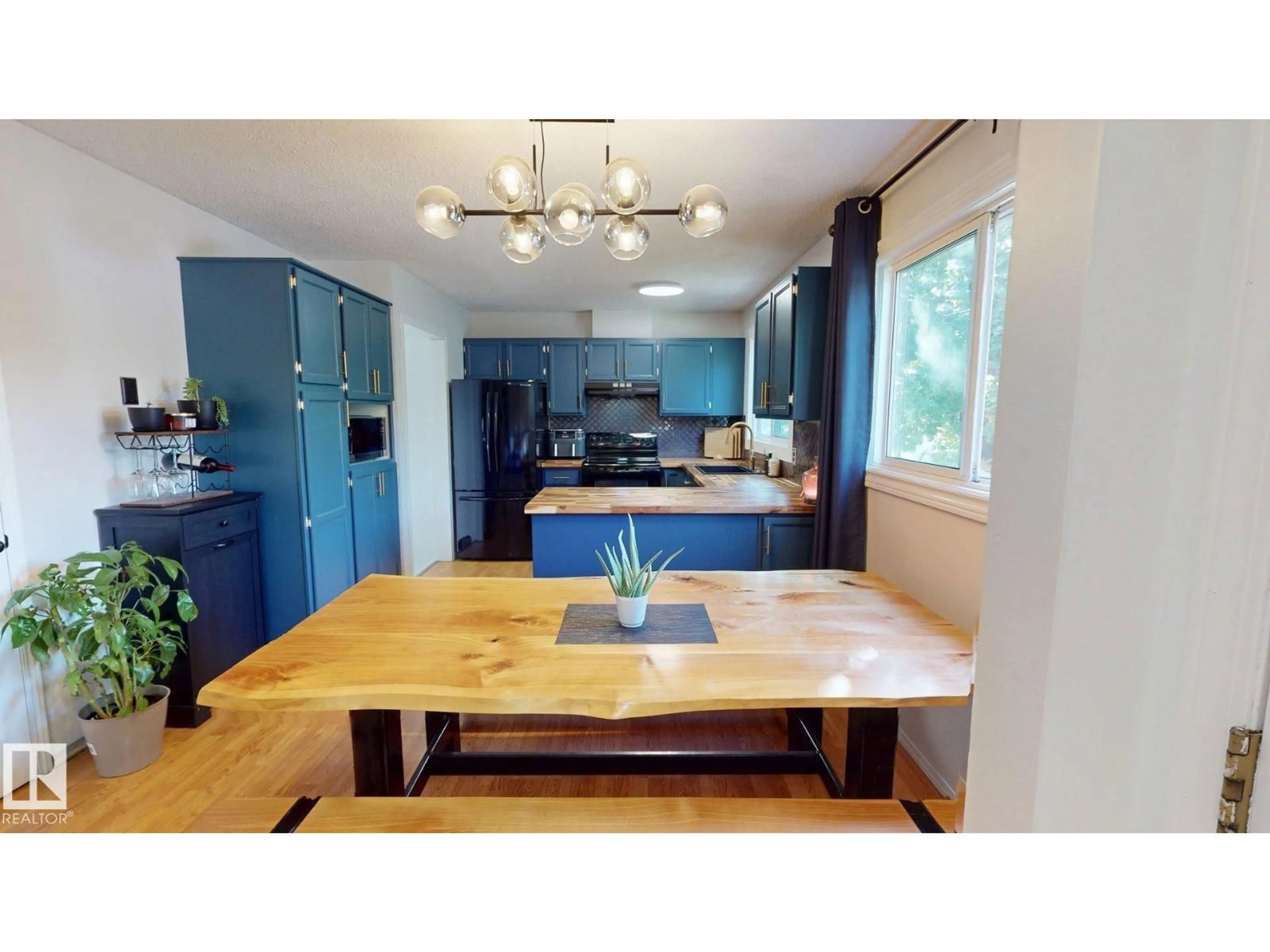 Open concept kitchen, wood/laminate floor for 5616 45 AVE, Drayton Valley Alberta T7A1K3