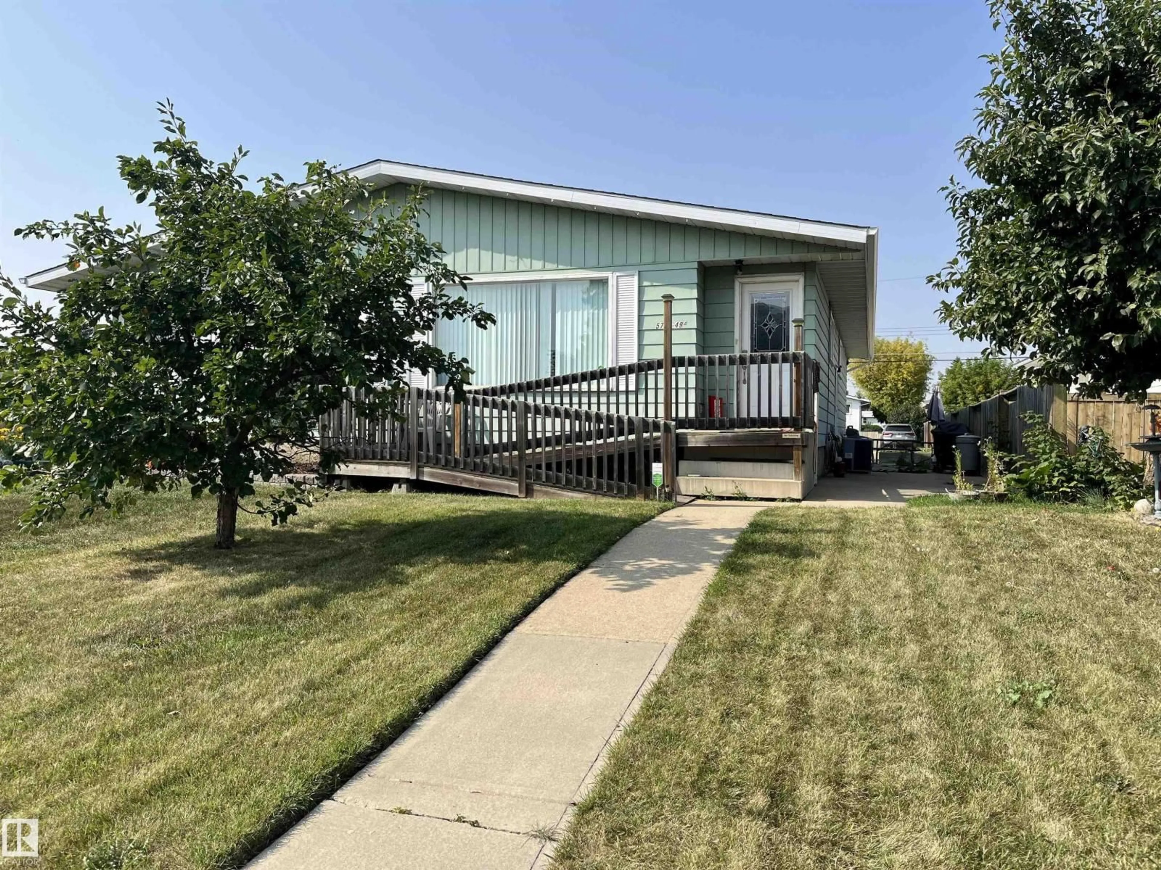 Home with vinyl exterior material, street for 5704 49A ST, Vegreville Alberta T9C1H6