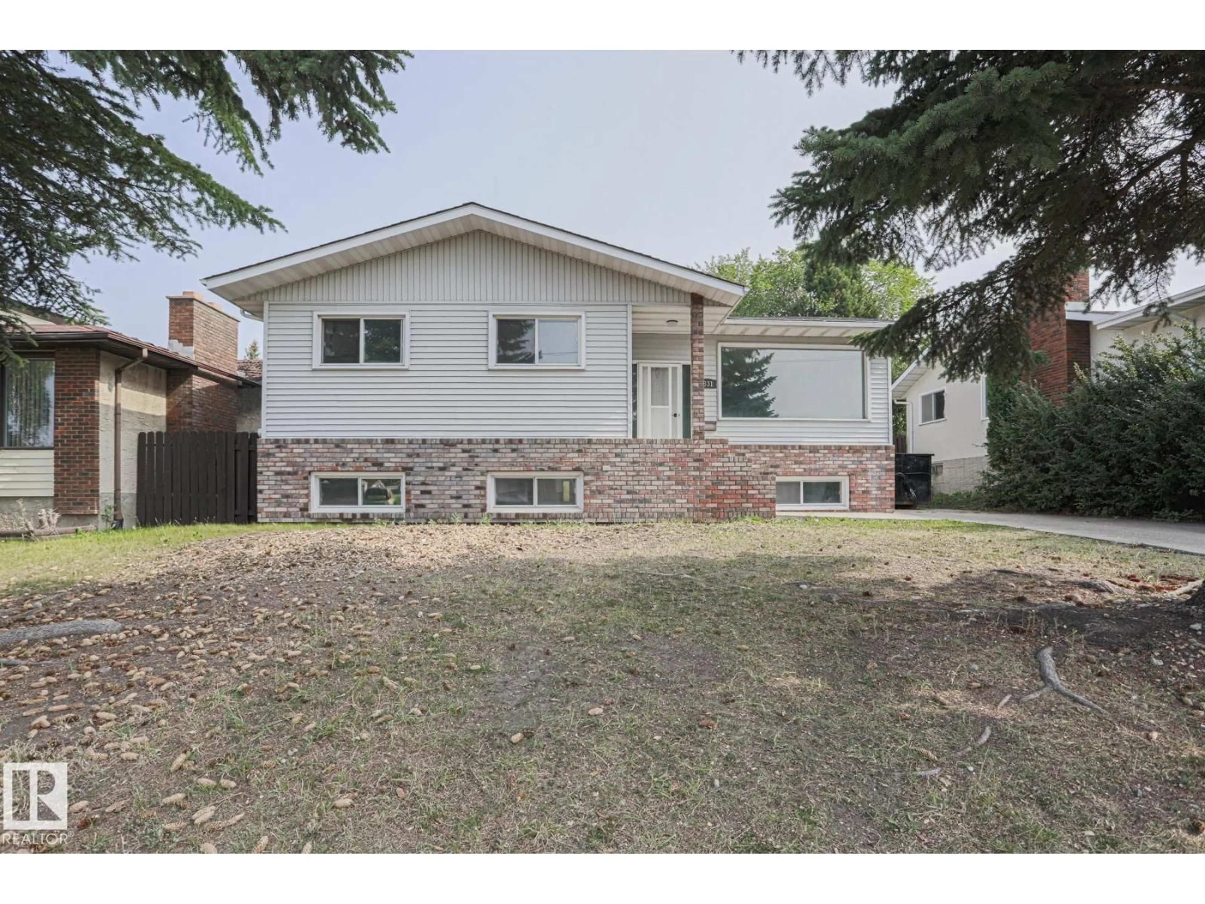 Home with brick exterior material, street for NW - 1831 51 ST, Edmonton Alberta T6L1X4
