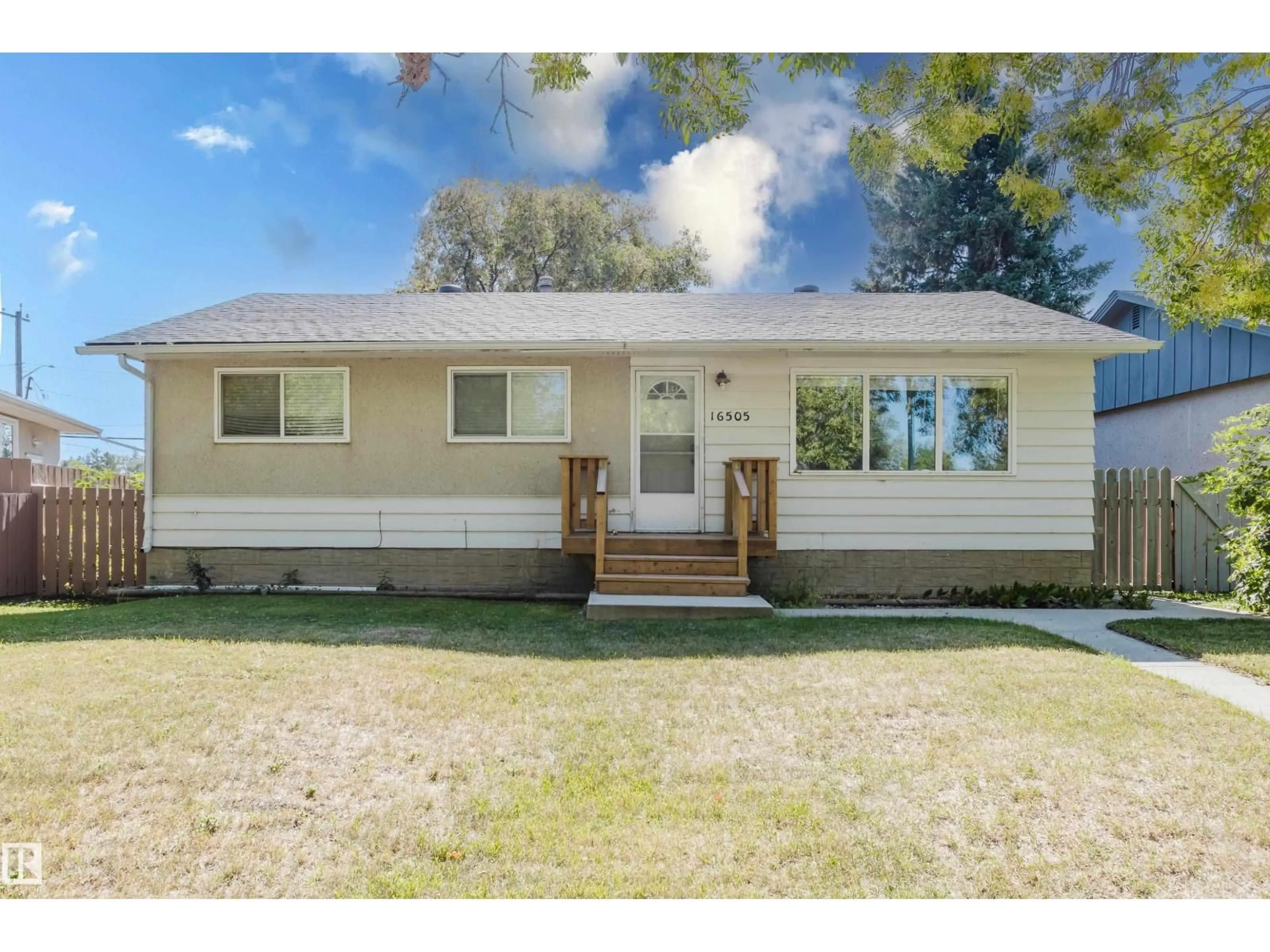 Home with vinyl exterior material, street for 16505 103 AV, Edmonton Alberta T5P0R1