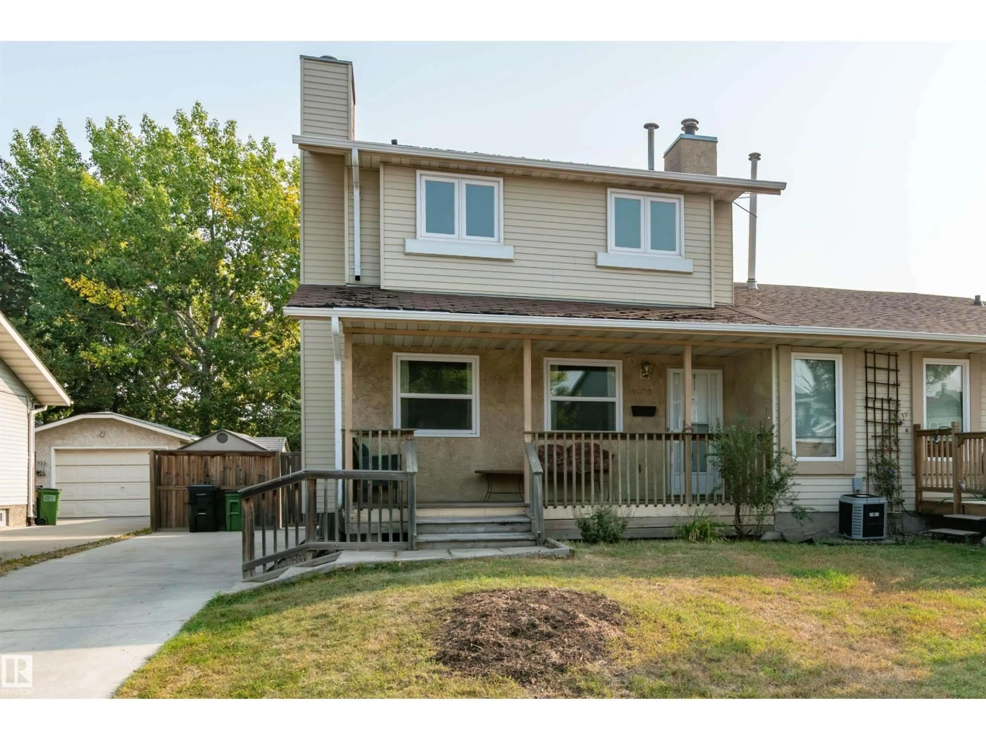 Home with vinyl exterior material, street for NW - 9409 173 ST, Edmonton Alberta T5T3G4
