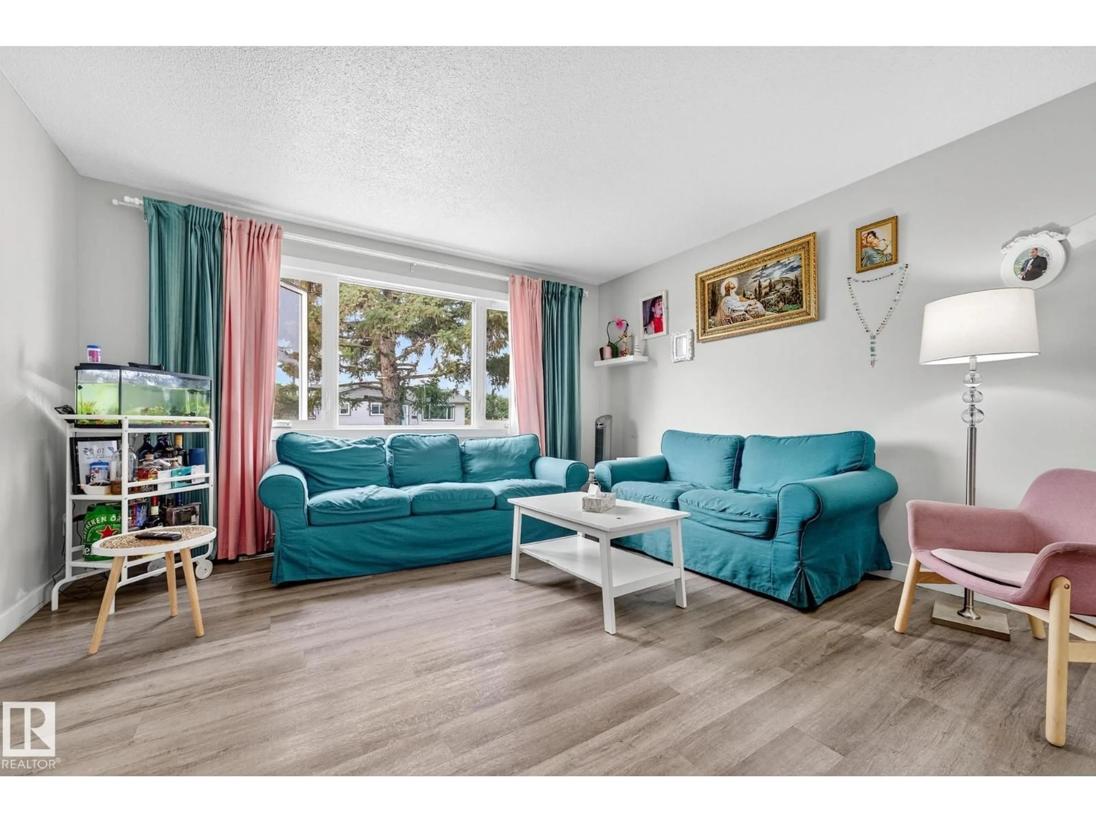 Living room with furniture, wood/laminate floor for 13703 87 ST, Edmonton Alberta T5E3G1