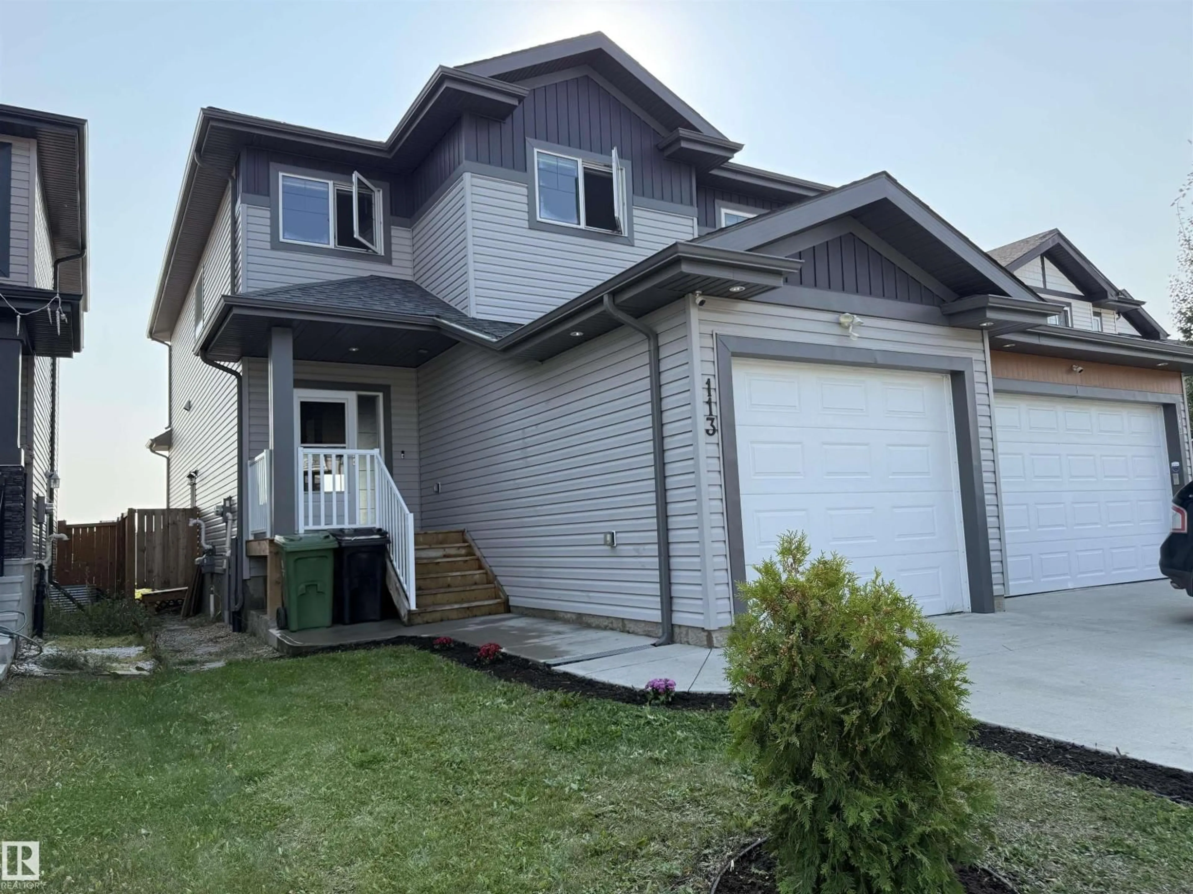 Home with vinyl exterior material, street for 113 RICHMOND LI, Fort Saskatchewan Alberta T8L0S6