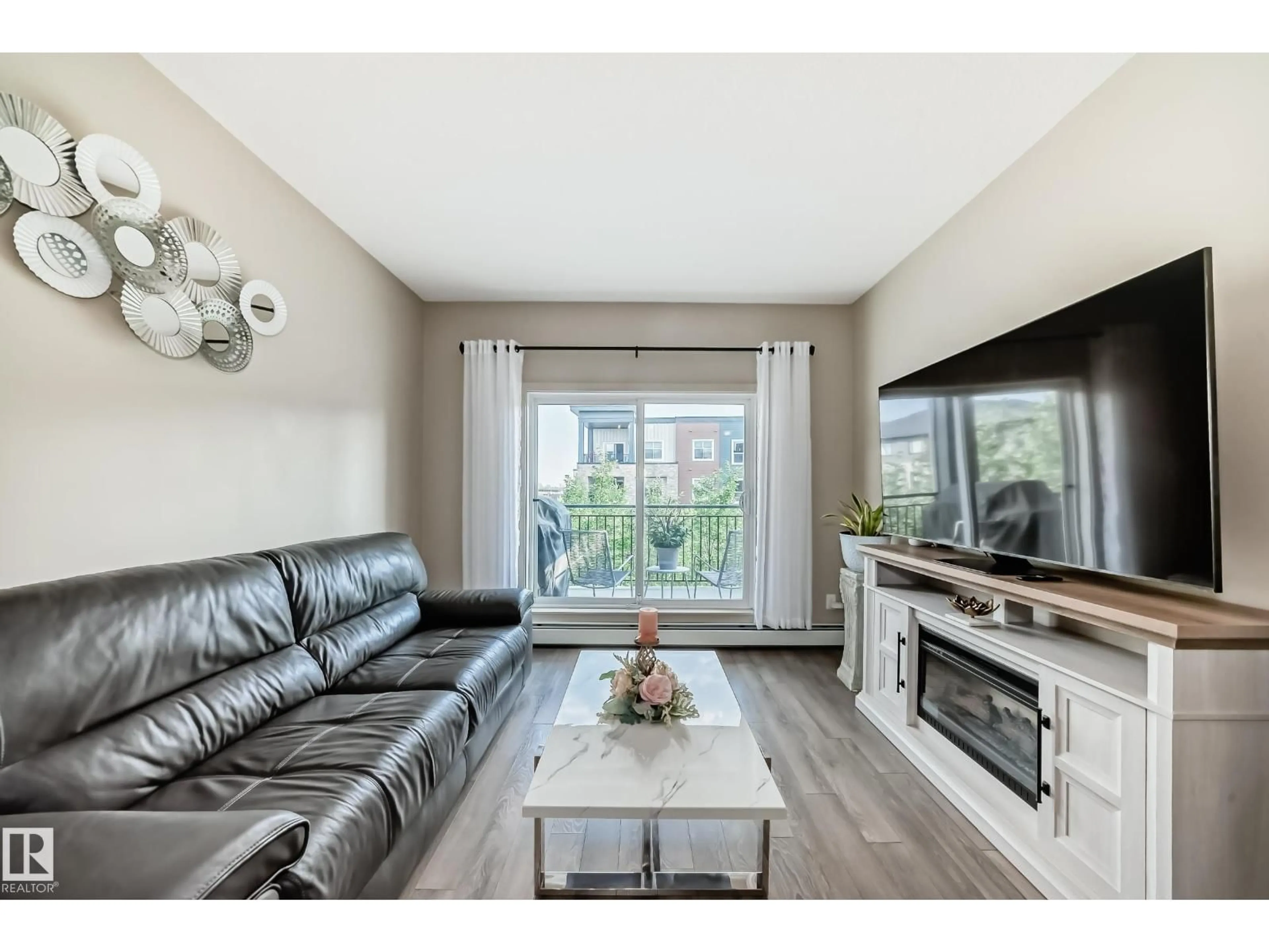 Living room with furniture, unknown for #327 - 508 GRIESBACH PR, Edmonton Alberta T5E6V9