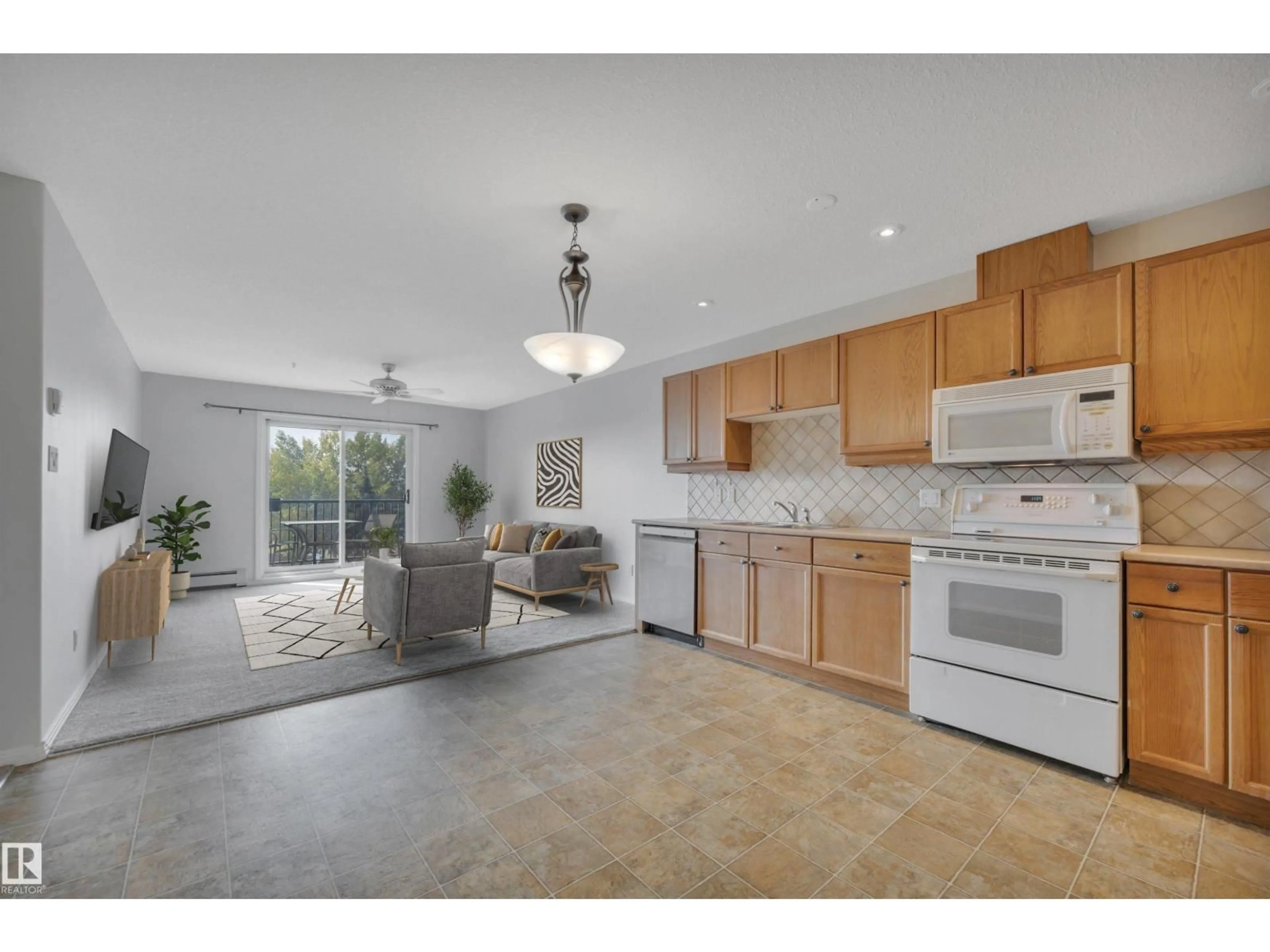 Open concept kitchen, ceramic/tile floor for 592 - 331 HOOKE RD, Edmonton Alberta T5A5H2