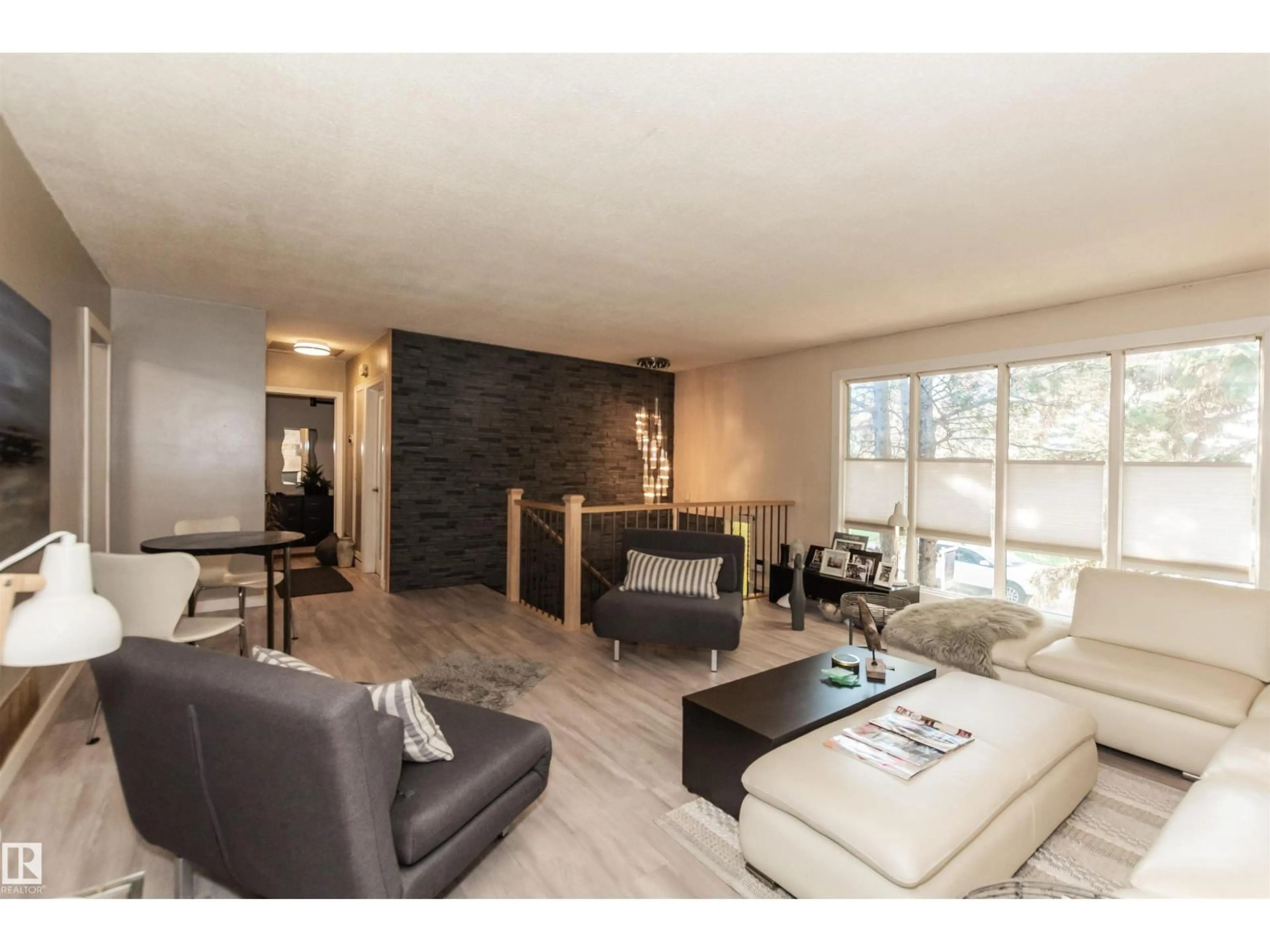 Living room with furniture, wood/laminate floor for 13208 128 AV, Edmonton Alberta T5L3H2