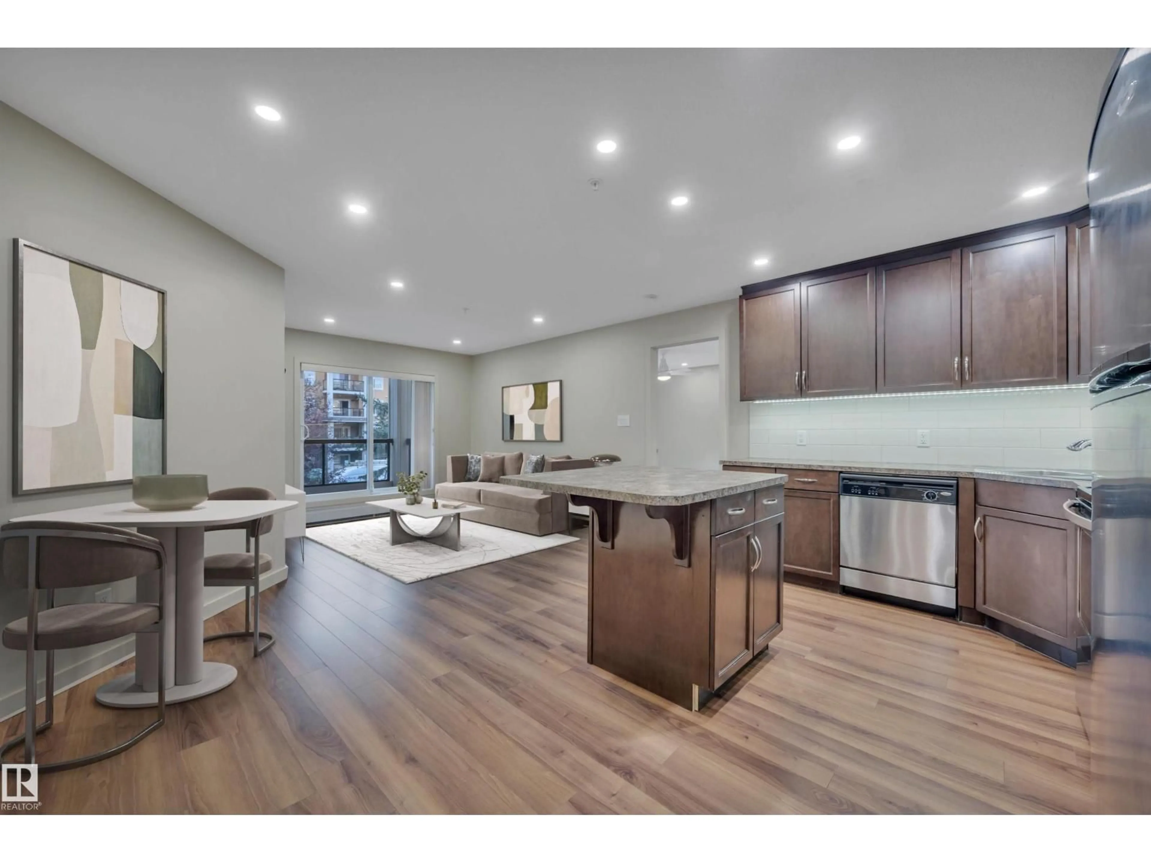 Open concept kitchen, wood/laminate floor for #261 - 11517 ELLERSLIE RD, Edmonton Alberta T6W2A9