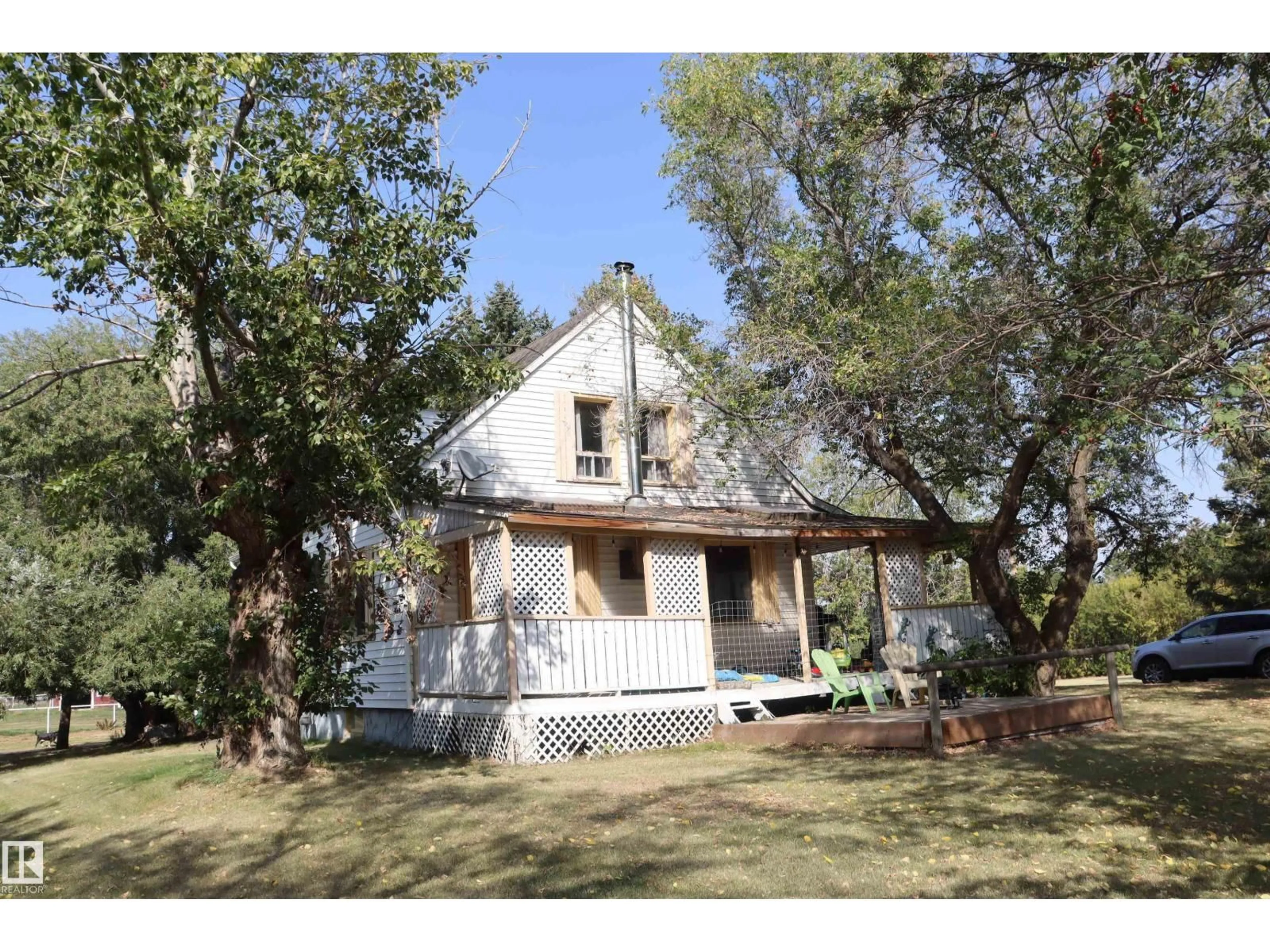 Home with vinyl exterior material, street for 243066 TWP. RD., Rural Wetaskiwin County Alberta T9A2G3