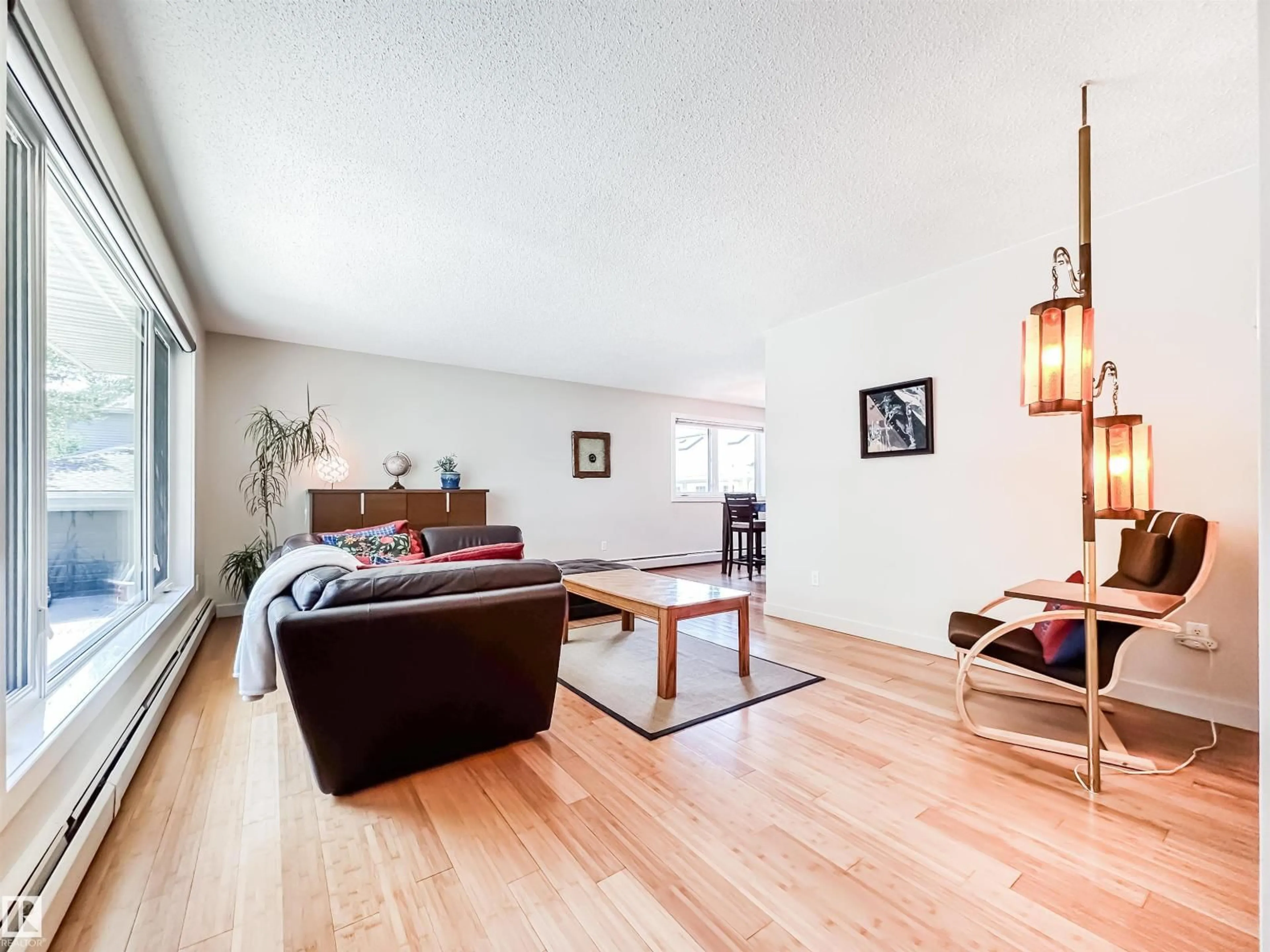 Living room with furniture, wood/laminate floor for 11116 69 ST, Edmonton Alberta T5B1R4