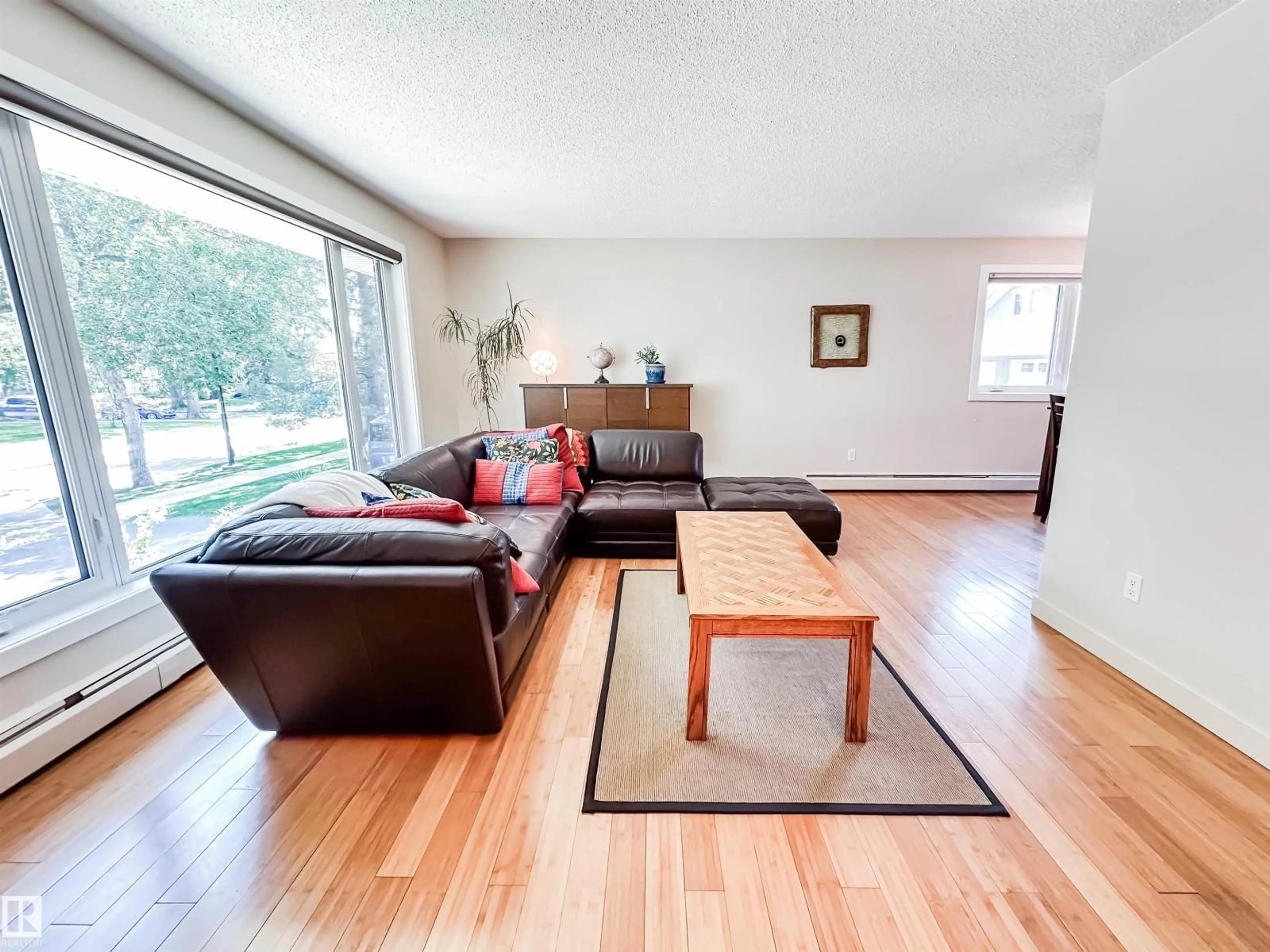 Living room with furniture, wood/laminate floor for 11116 69 ST, Edmonton Alberta T5B1R4