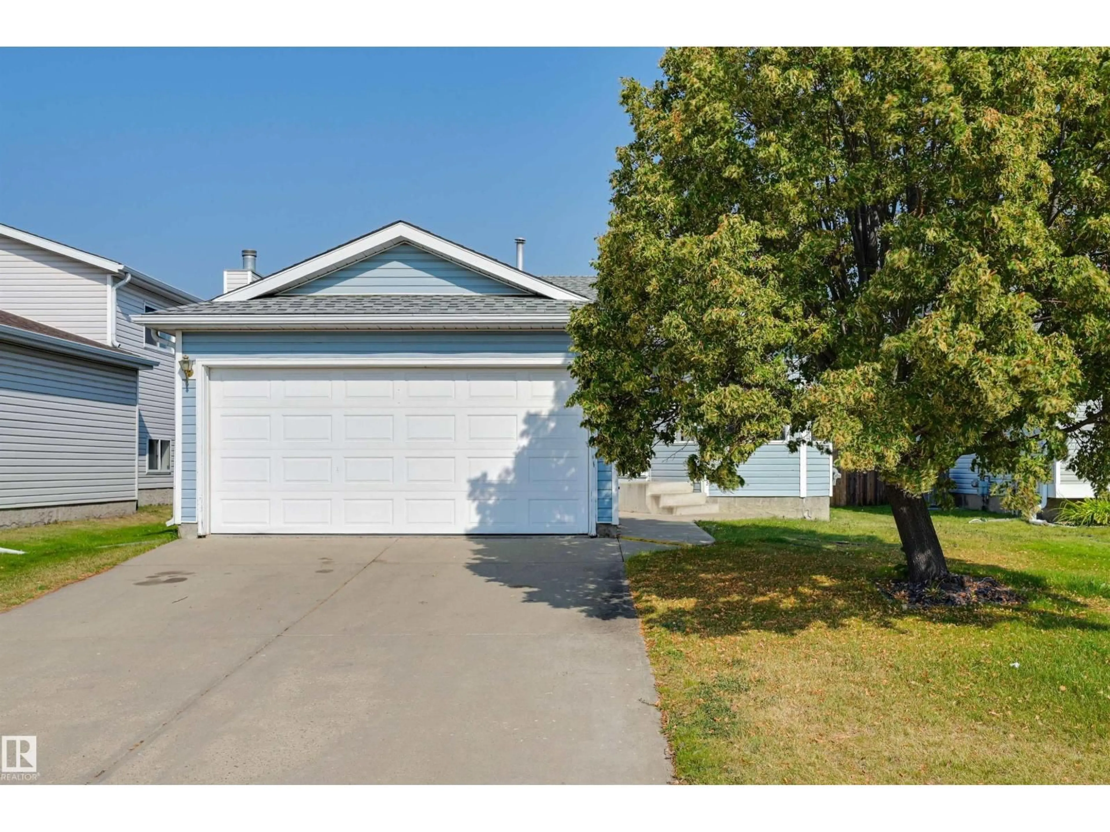 Home with vinyl exterior material, street for NW - 1928 152 AV, Edmonton Alberta T5Y2R7