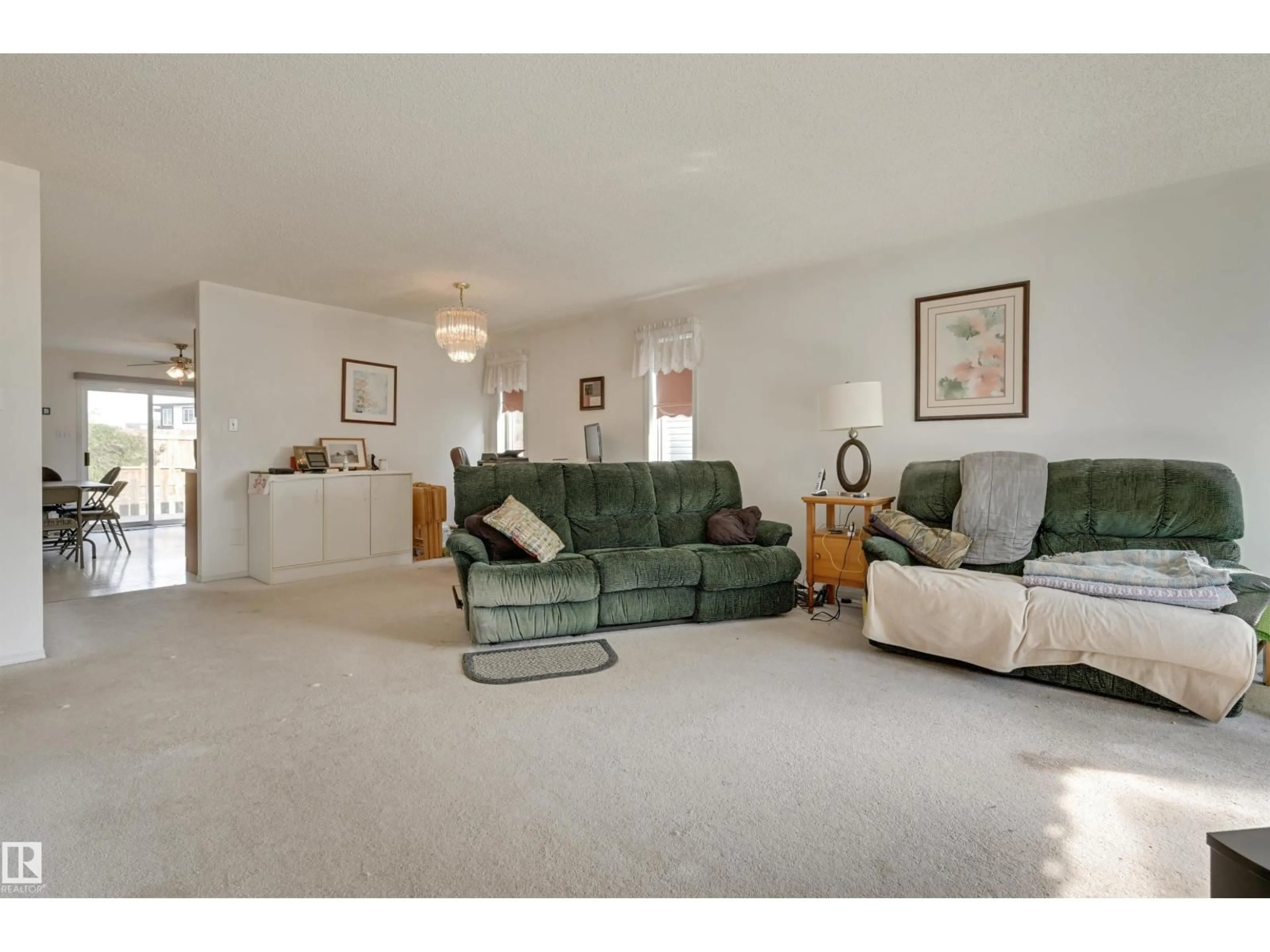 Living room with furniture, unknown for NW - 1928 152 AV, Edmonton Alberta T5Y2R7