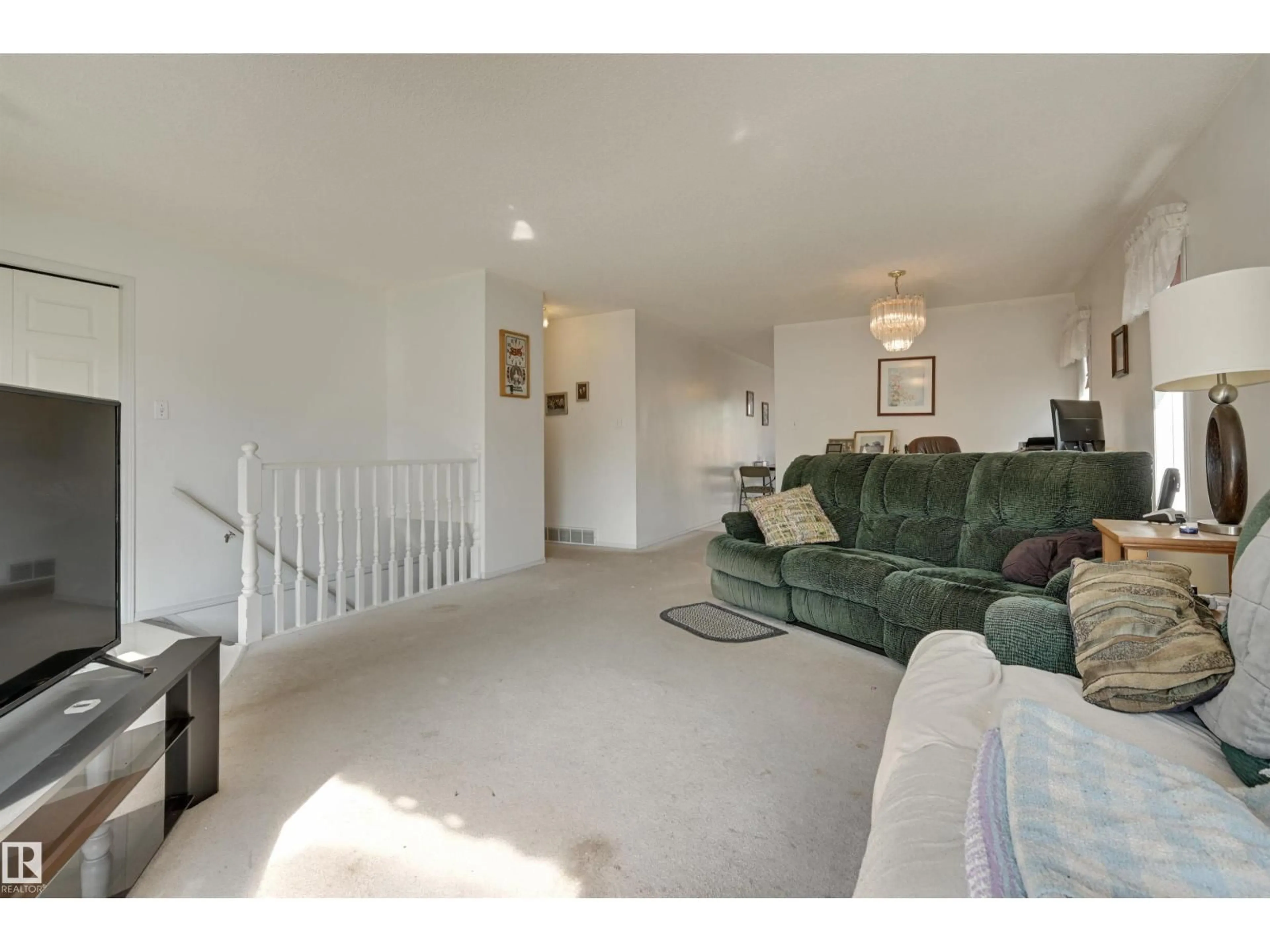 Living room with furniture, carpet floor for NW - 1928 152 AV, Edmonton Alberta T5Y2R7