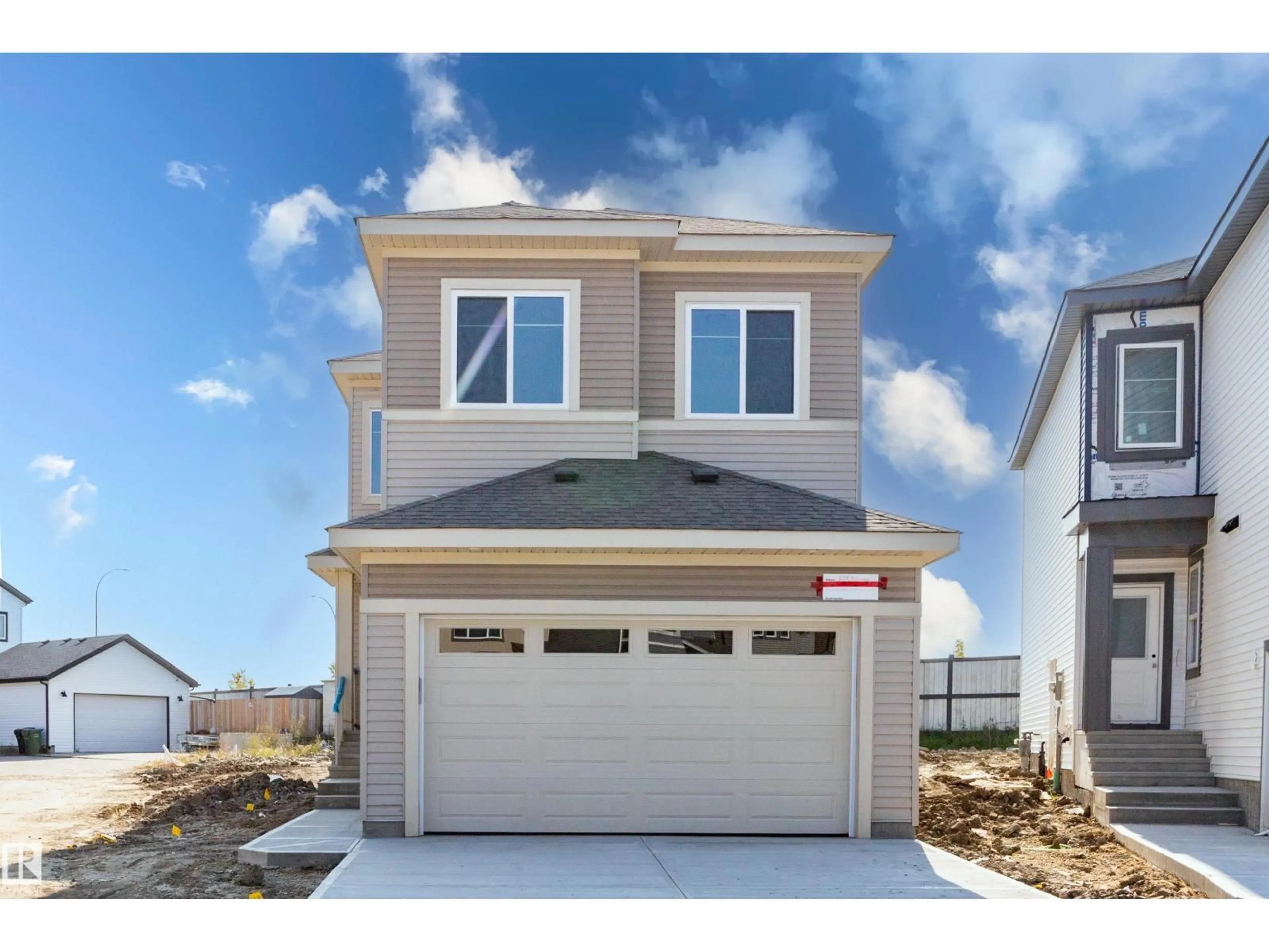Home with vinyl exterior material, street for 298 MUNN WY, Leduc Alberta T9E1V1