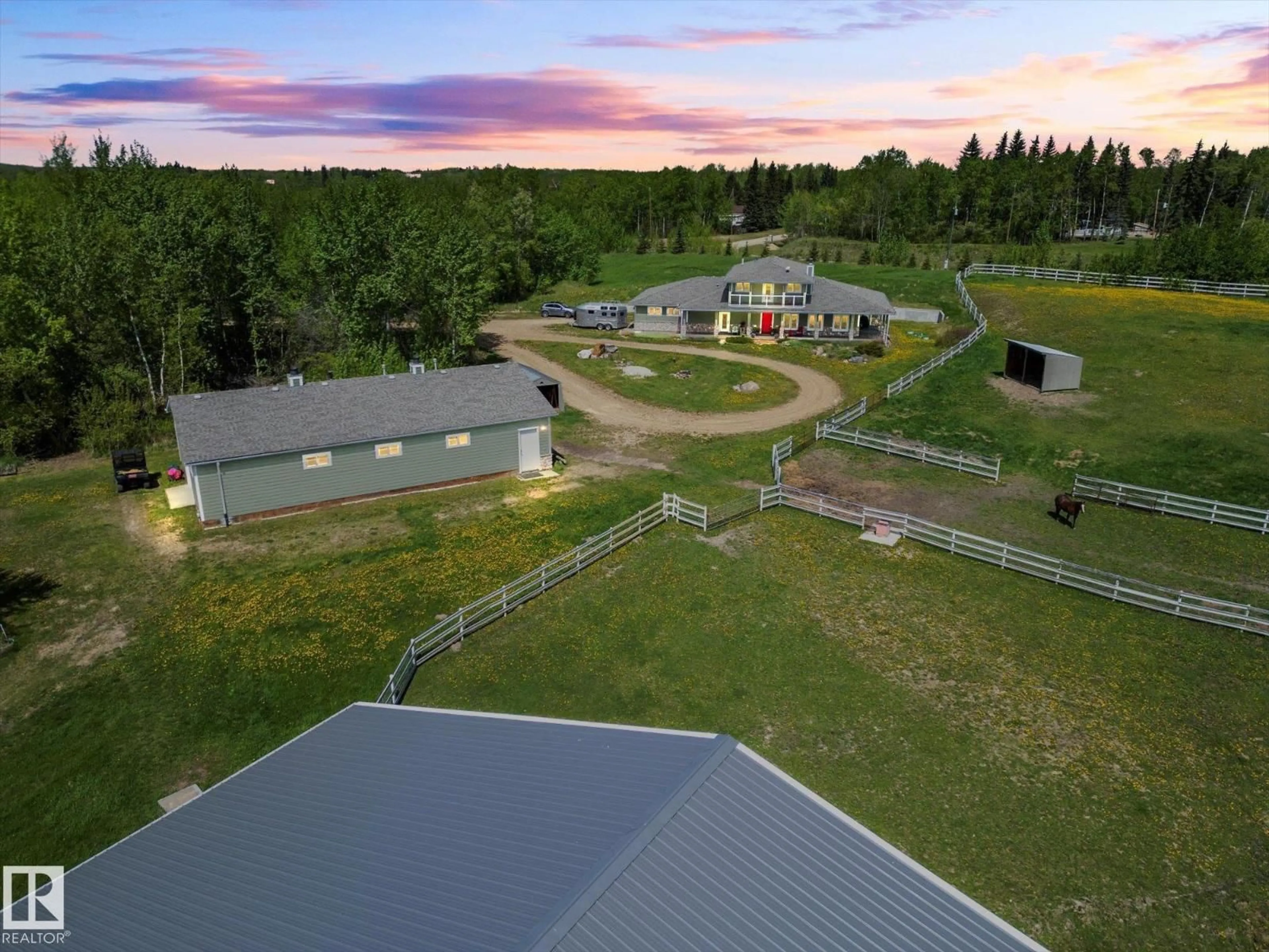 A pic from outside/outdoor area/front of a property/back of a property/a pic from drone, mountain view for 21031 TWP RD 530, Rural Strathcona County Alberta T8G2C7