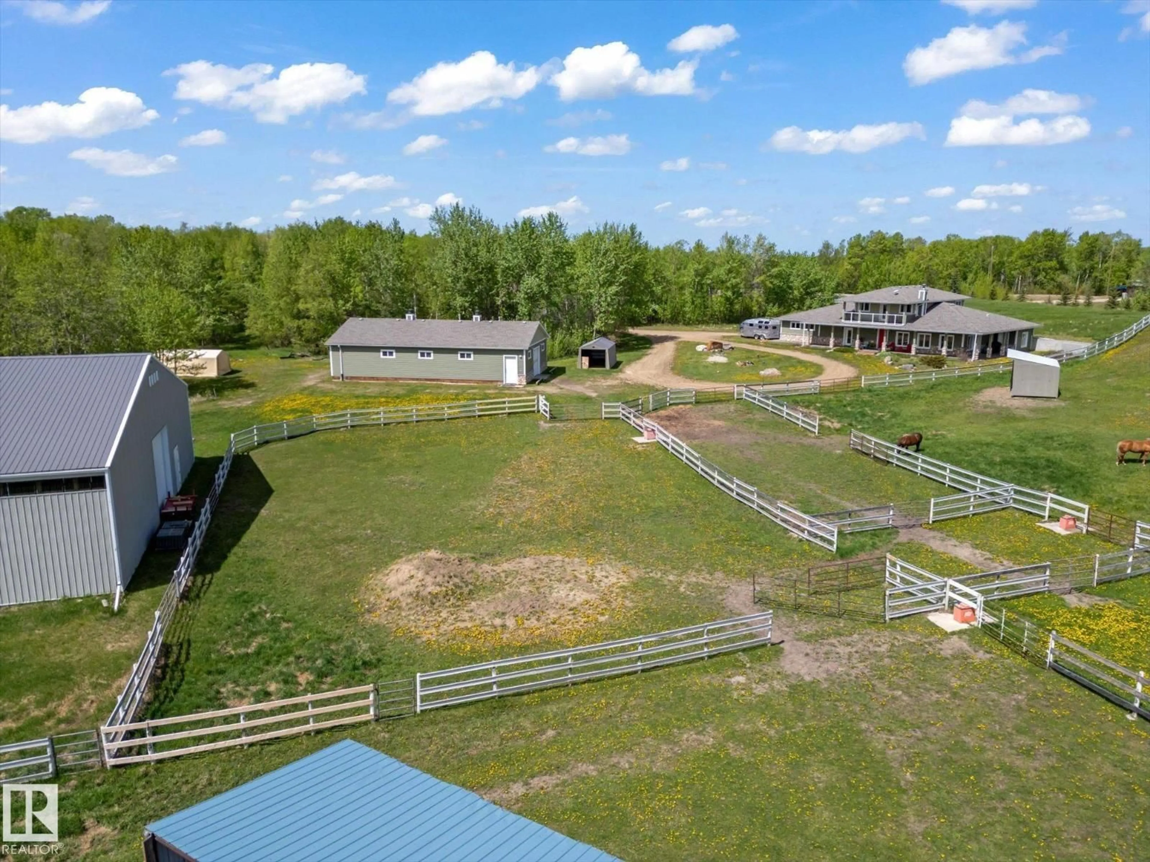 A pic from outside/outdoor area/front of a property/back of a property/a pic from drone, unknown for 21031 TWP RD 530, Rural Strathcona County Alberta T8G2C7