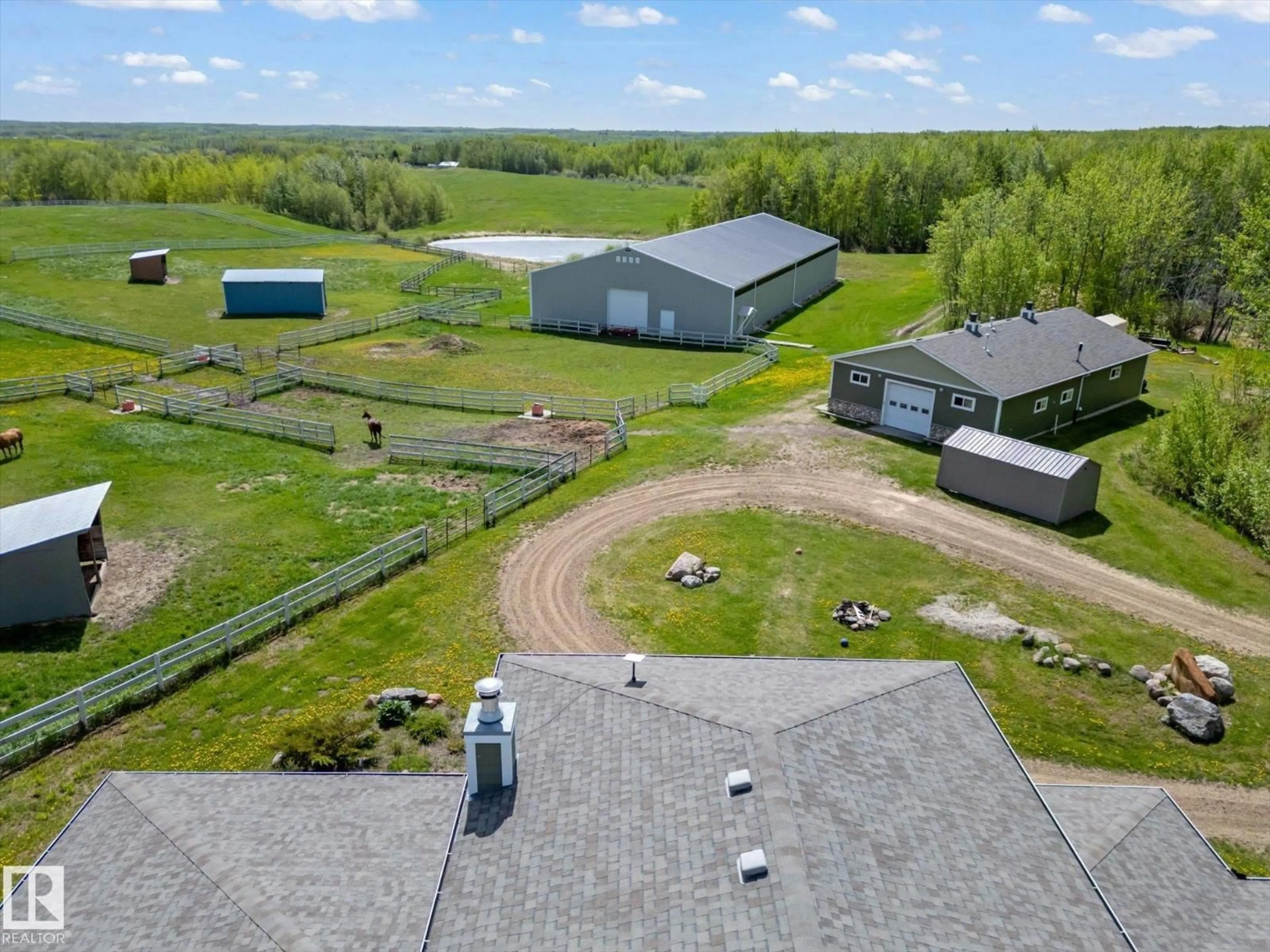 A pic from outside/outdoor area/front of a property/back of a property/a pic from drone, unknown for 21031 TWP RD 530, Rural Strathcona County Alberta T8G2C7