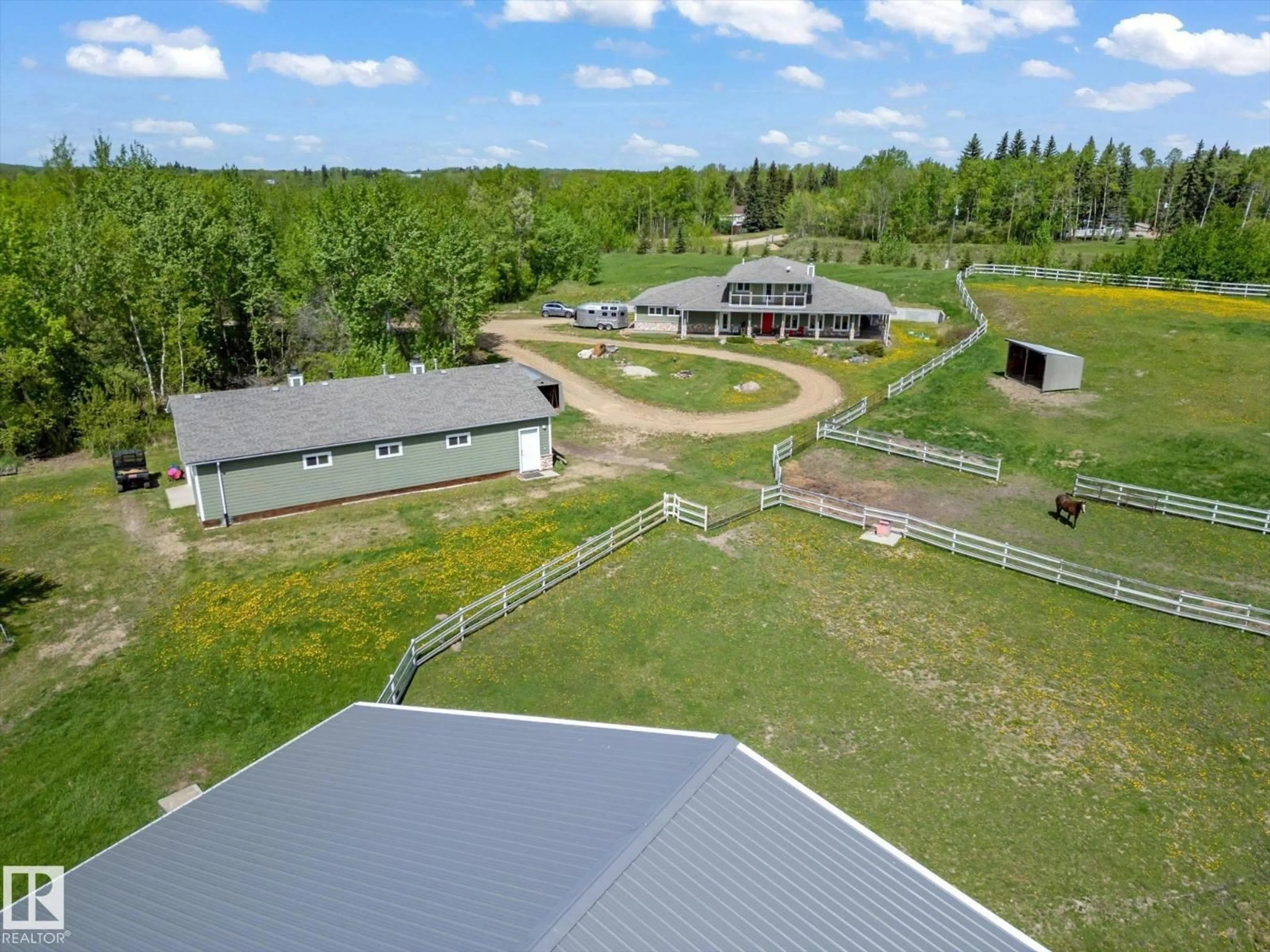 A pic from outside/outdoor area/front of a property/back of a property/a pic from drone, unknown for 21031 TWP RD 530, Rural Strathcona County Alberta T8G2C7