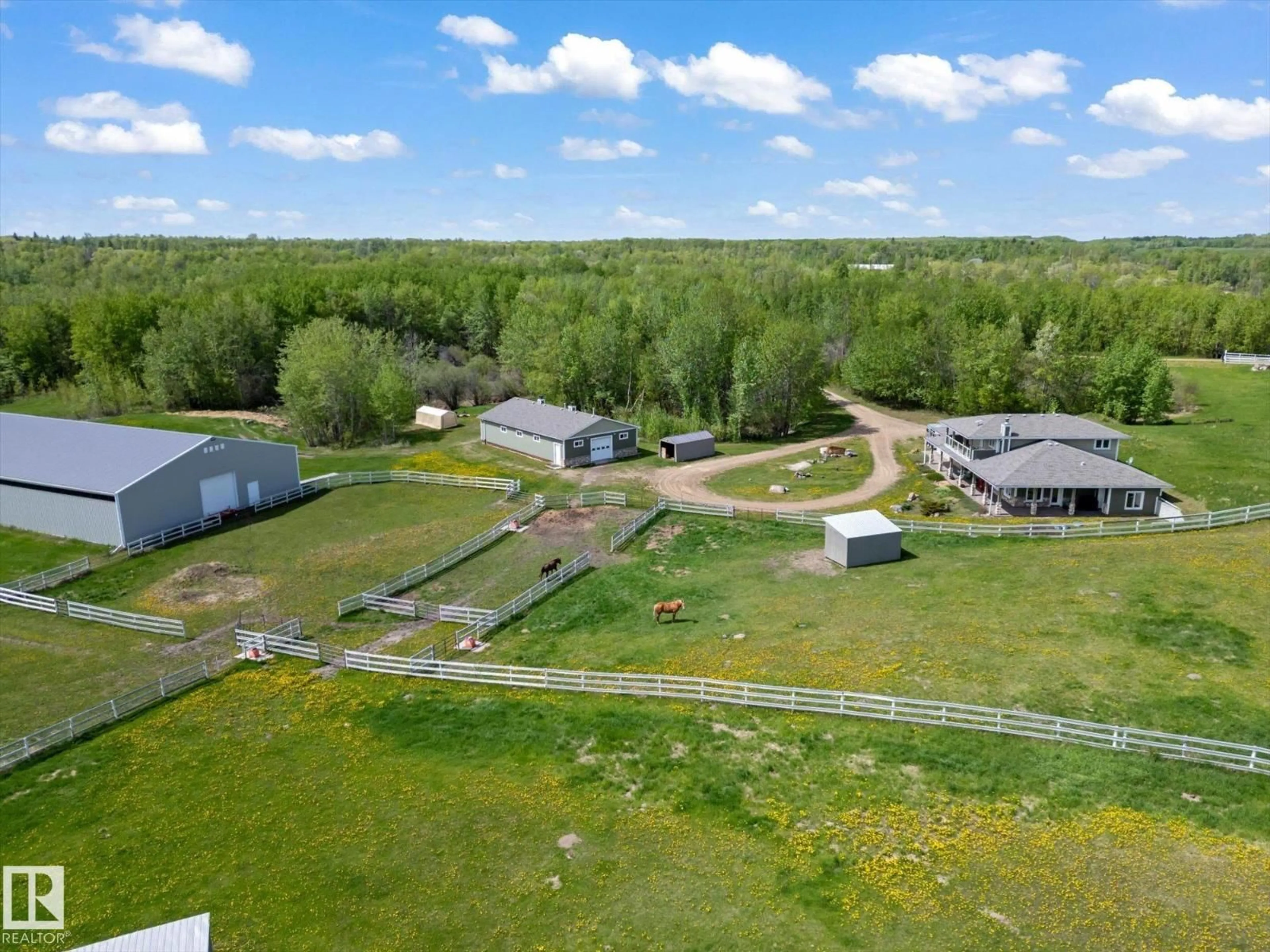A pic from outside/outdoor area/front of a property/back of a property/a pic from drone, unknown for 21031 TWP RD 530, Rural Strathcona County Alberta T8G2C7