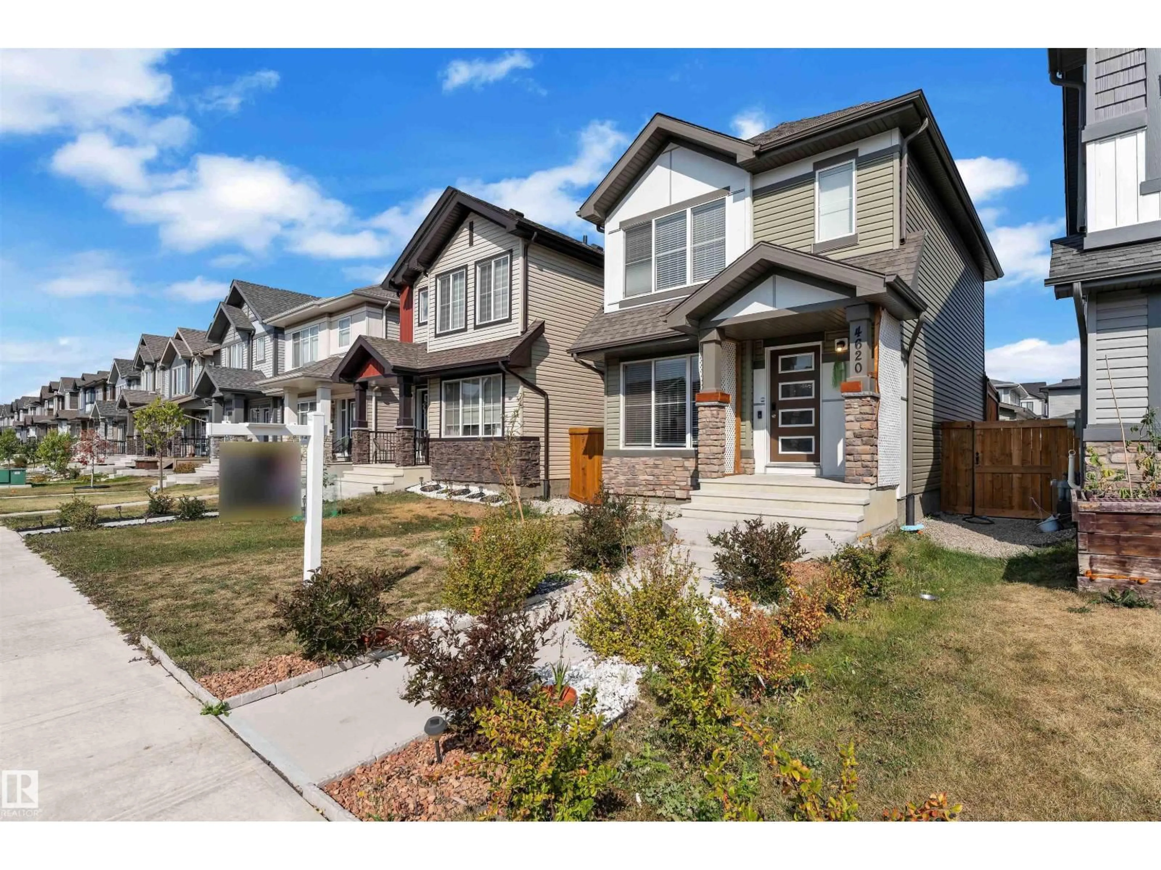 Home with brick exterior material, street for NW - 4620 175 AV, Edmonton Alberta T5Y4A1