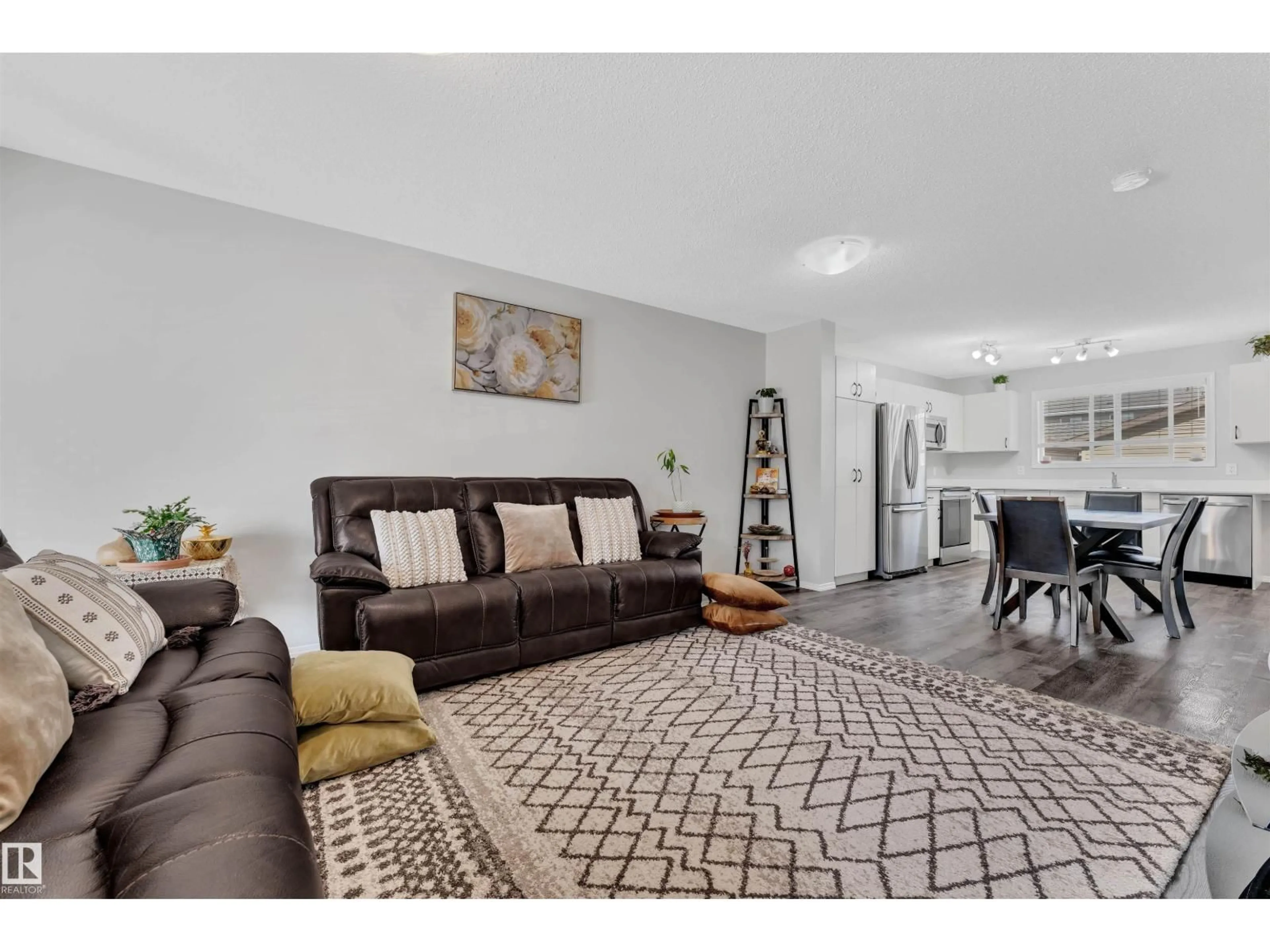 Living room with furniture, unknown for NW - 4620 175 AV, Edmonton Alberta T5Y4A1