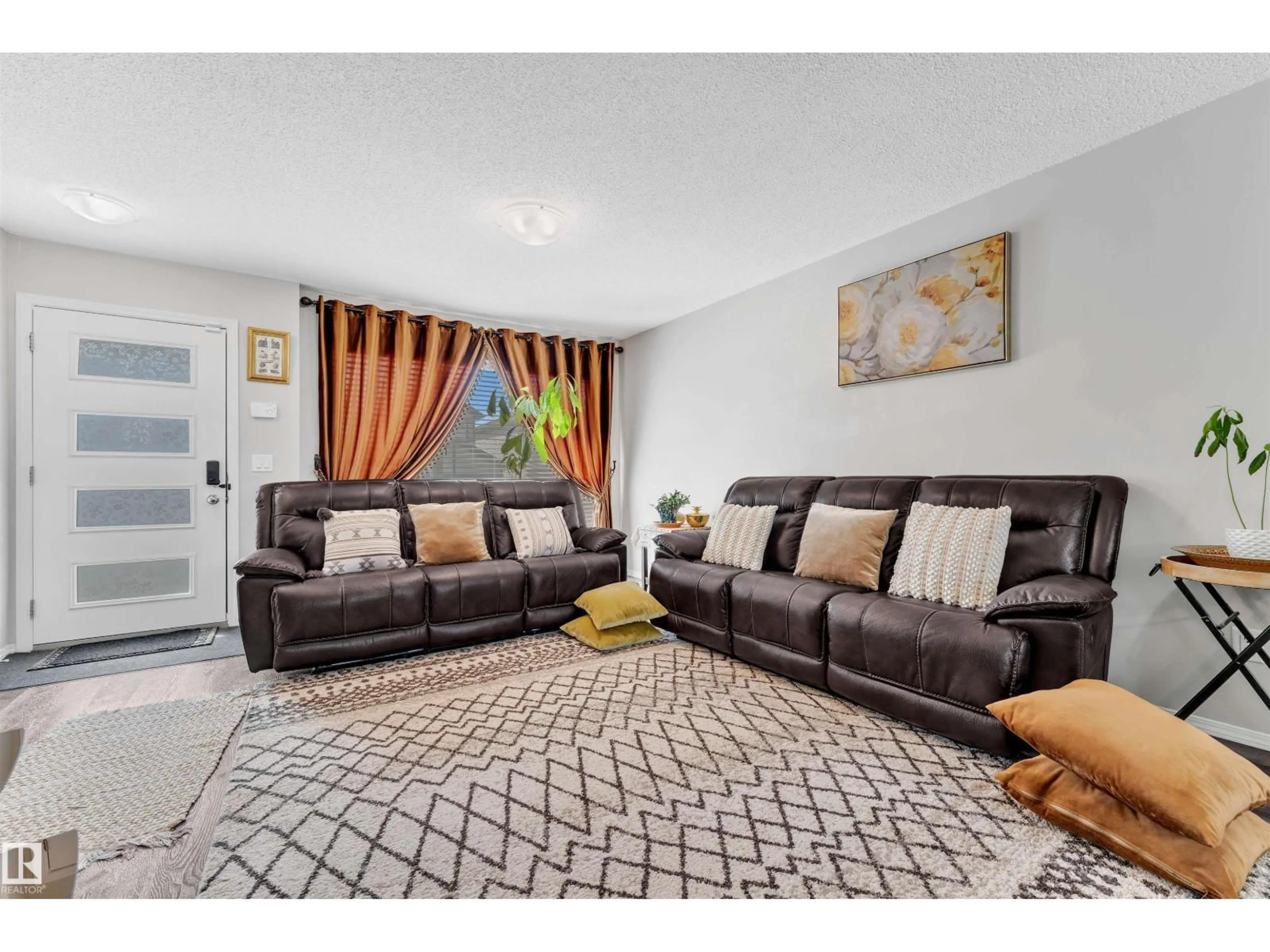 Living room with furniture, carpet floor for NW - 4620 175 AV, Edmonton Alberta T5Y4A1