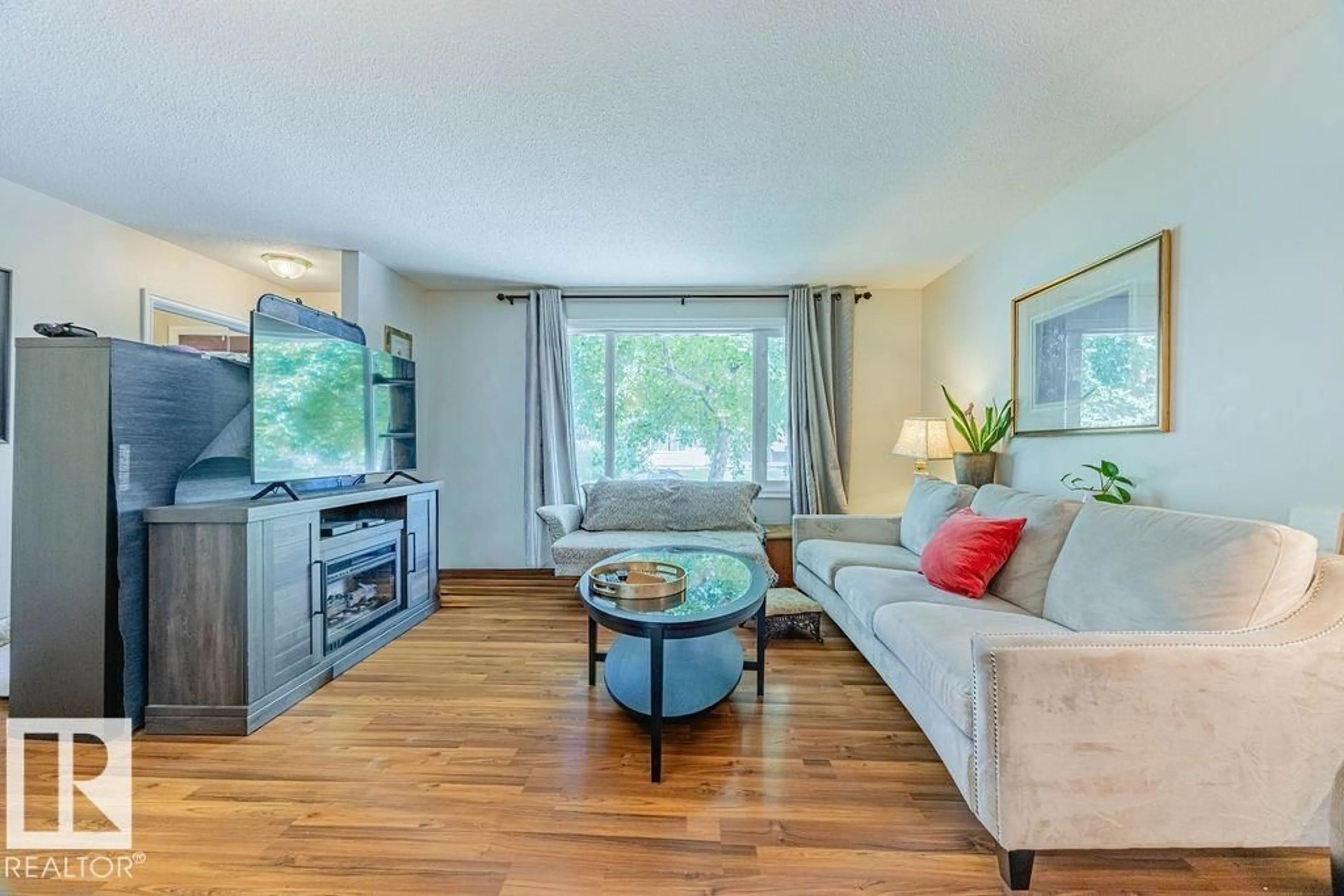 Living room with furniture, wood/laminate floor for 18 GLAMORGAN DR, Sherwood Park Alberta T8A2Y4