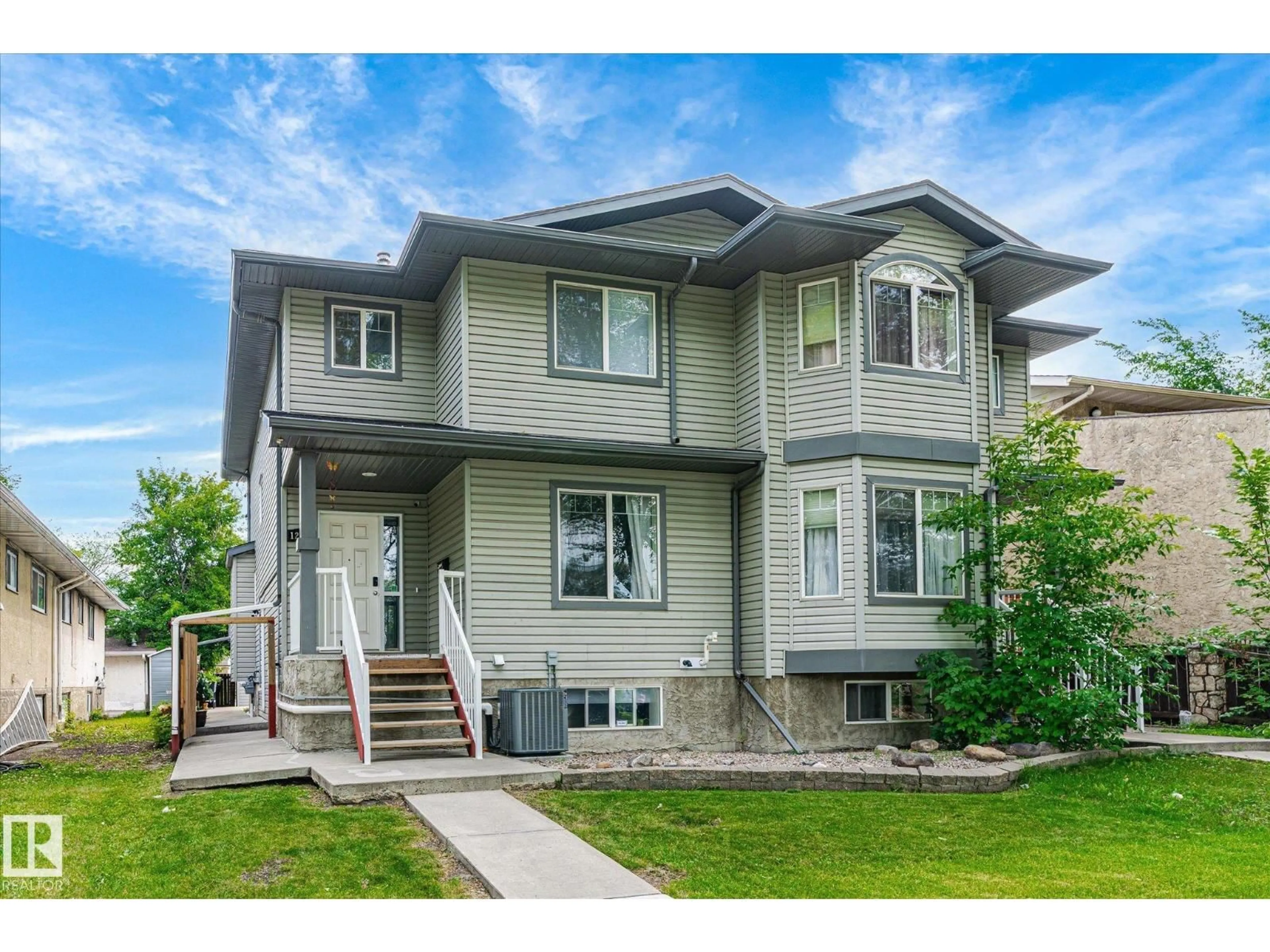 Home with vinyl exterior material, street for NW - 12727 123A ST, Edmonton Alberta T5L0K6
