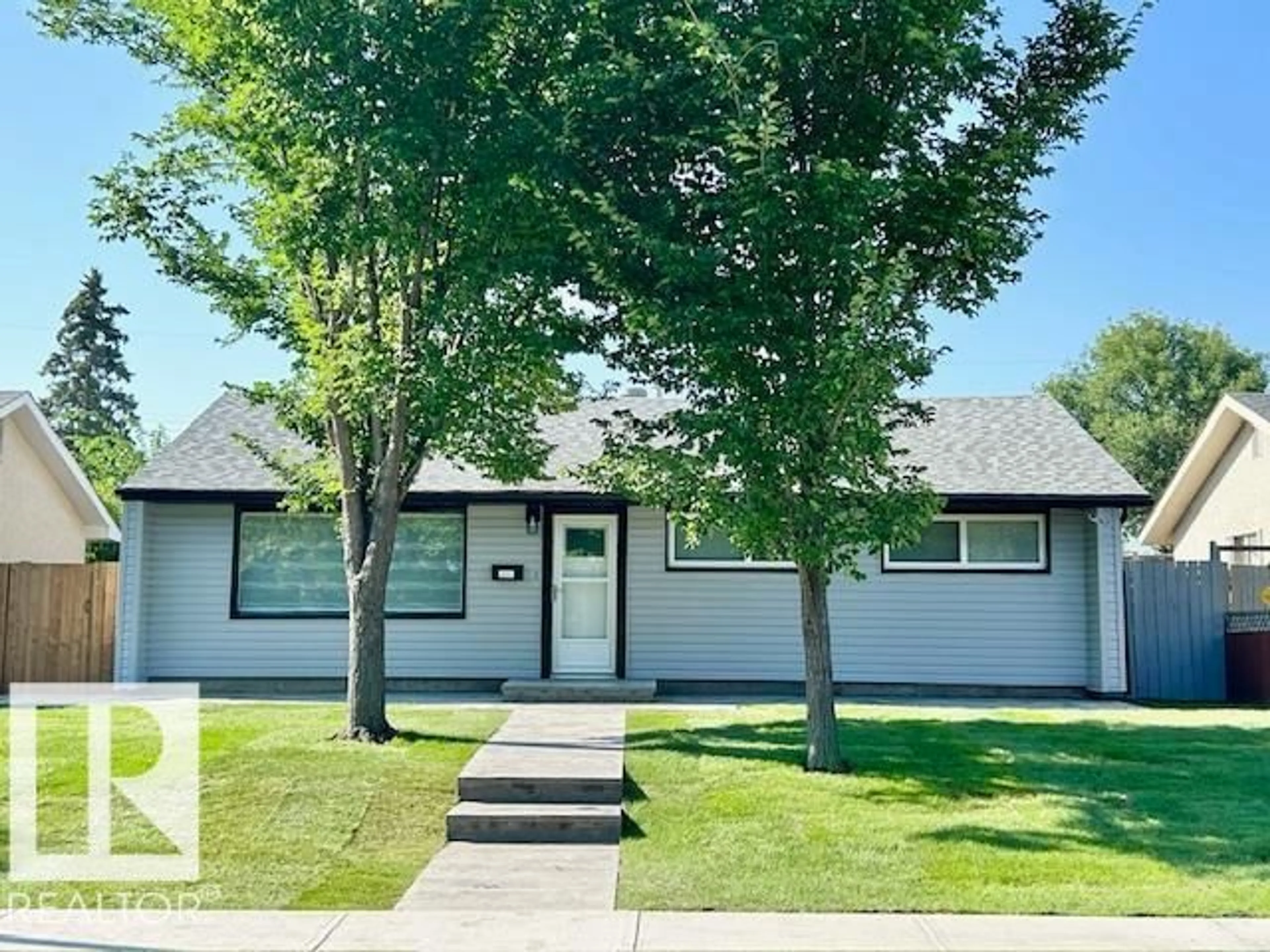 Home with vinyl exterior material, street for NW - 8811 130A AV, Edmonton Alberta T5E0V7