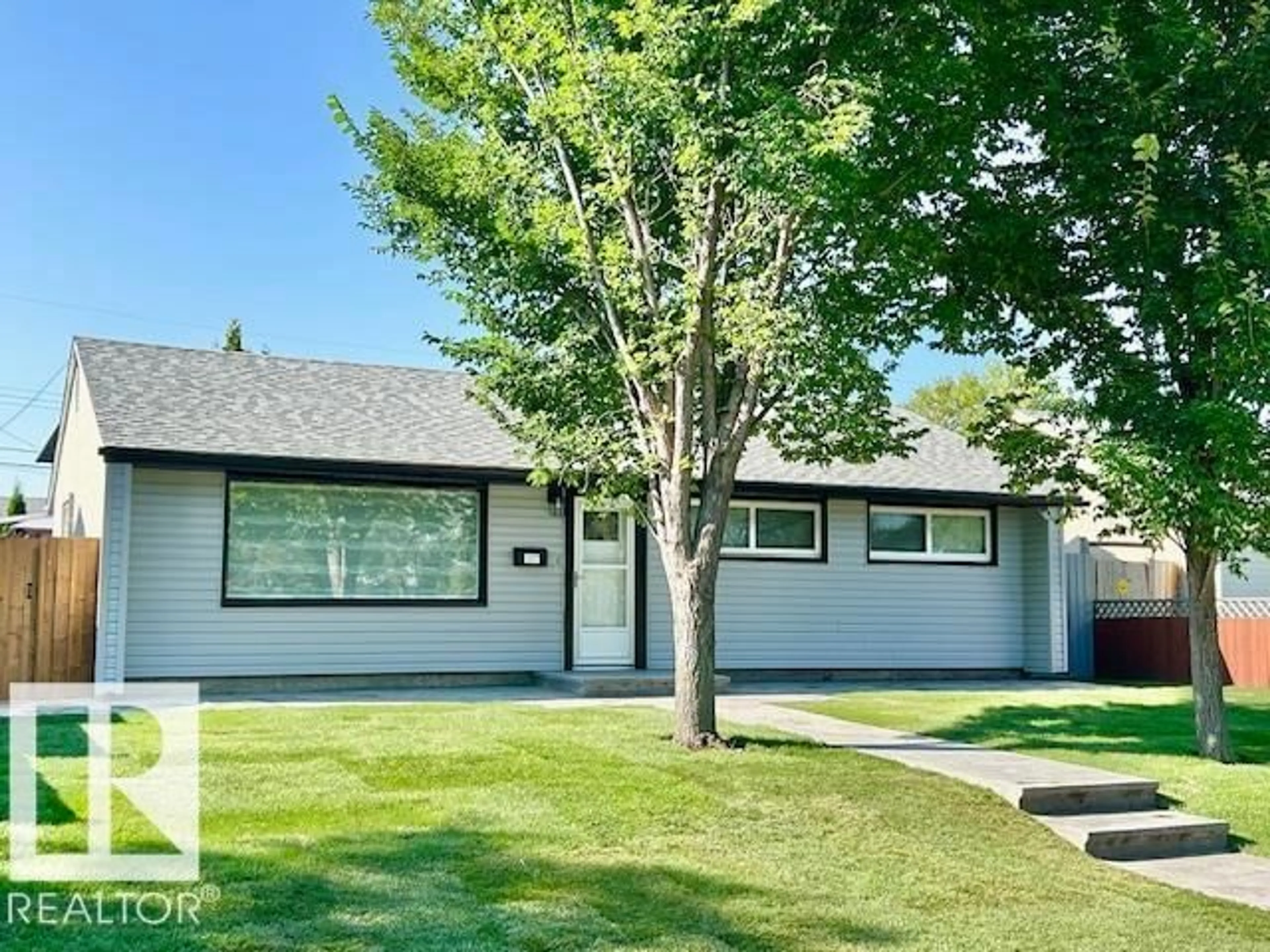 Home with vinyl exterior material, street for NW - 8811 130A AV, Edmonton Alberta T5E0V7