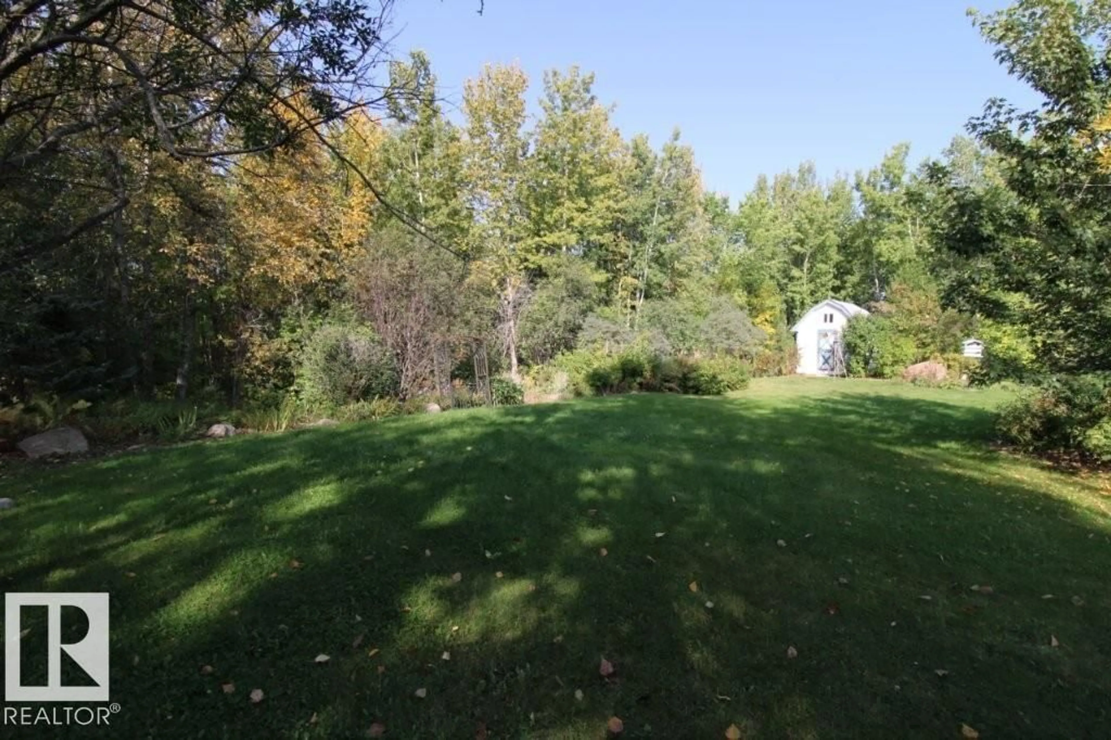 A pic from outside/outdoor area/front of a property/back of a property/a pic from drone, forest/trees view for 6 - 1121 HGHWAY 633, Rural Parkland County Alberta T7Y0A4