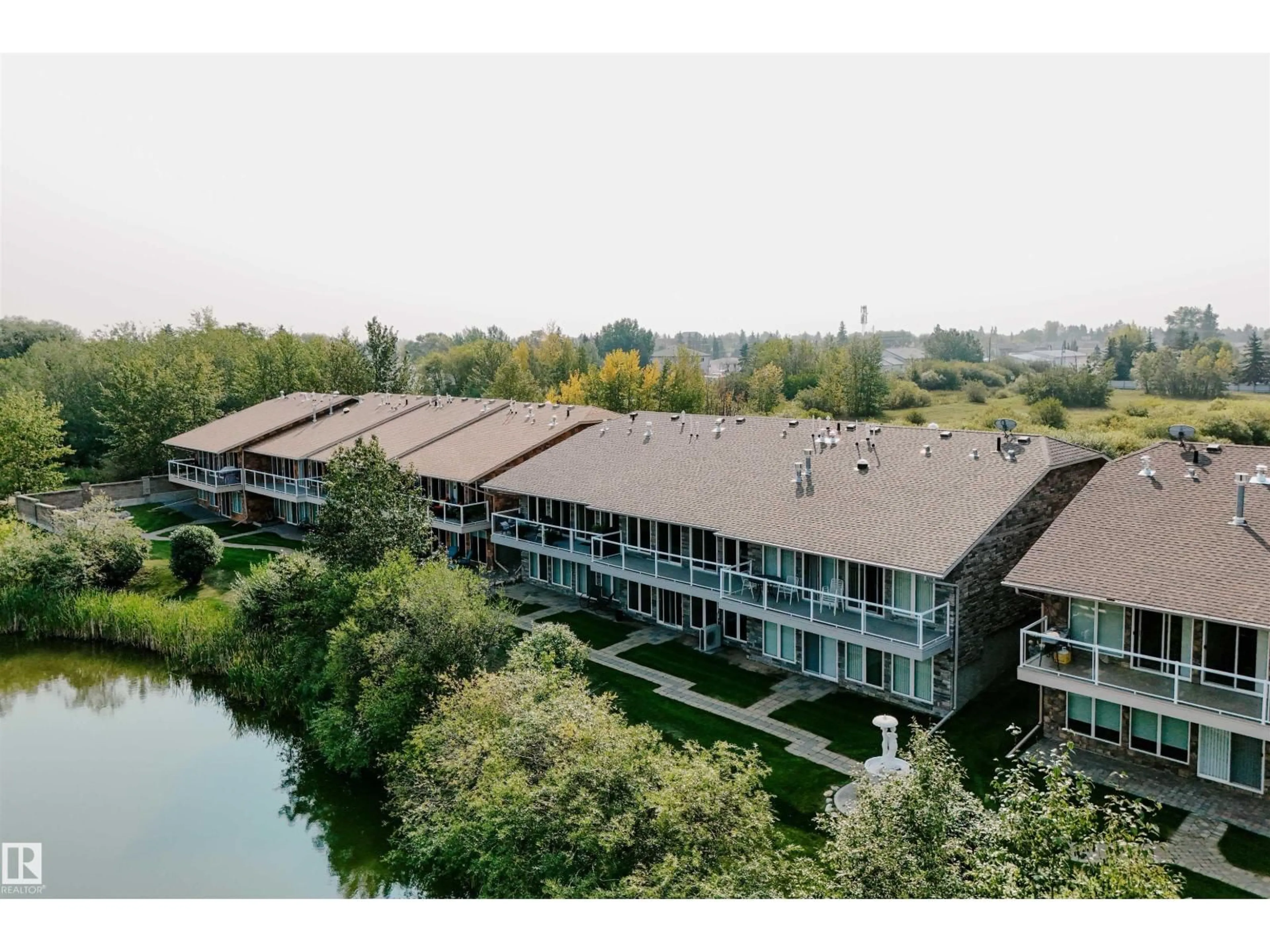 A pic from outside/outdoor area/front of a property/back of a property/a pic from drone, city buildings view from balcony for #8 - 10500 103 AV, Morinville Alberta T8R0E7